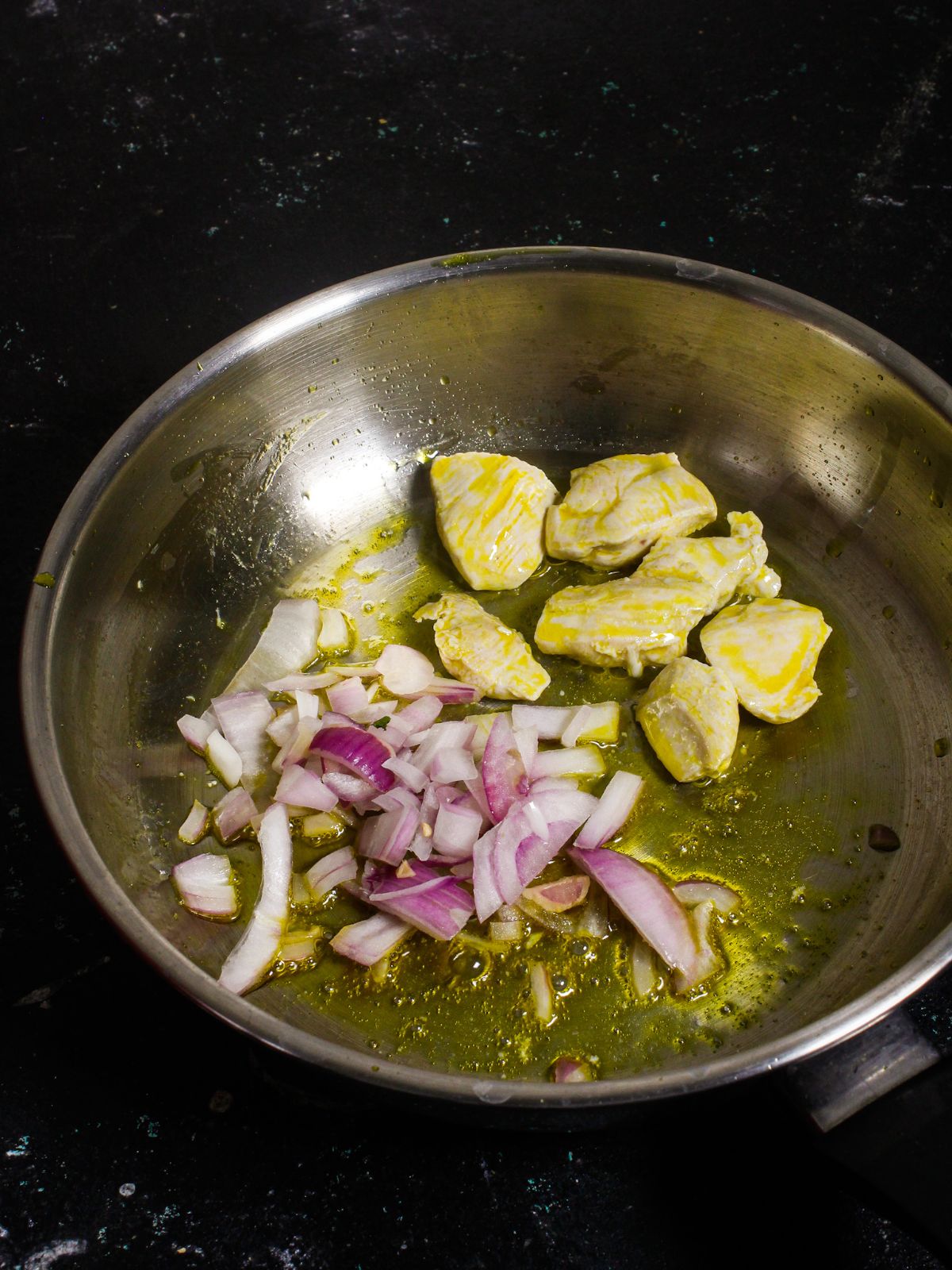 Add chopped onions to the pan 