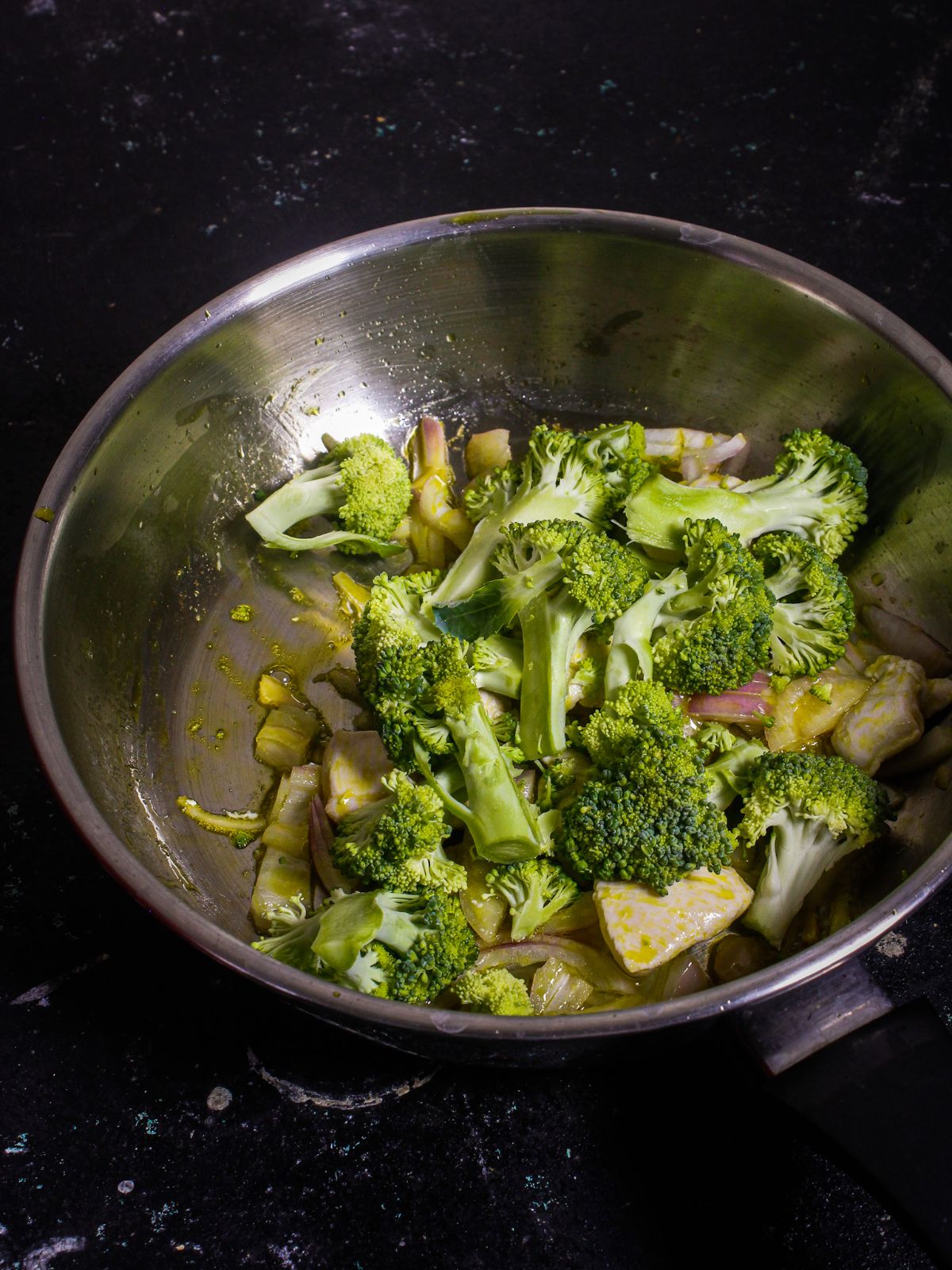 Add chopped broccoli to the pan and saute 