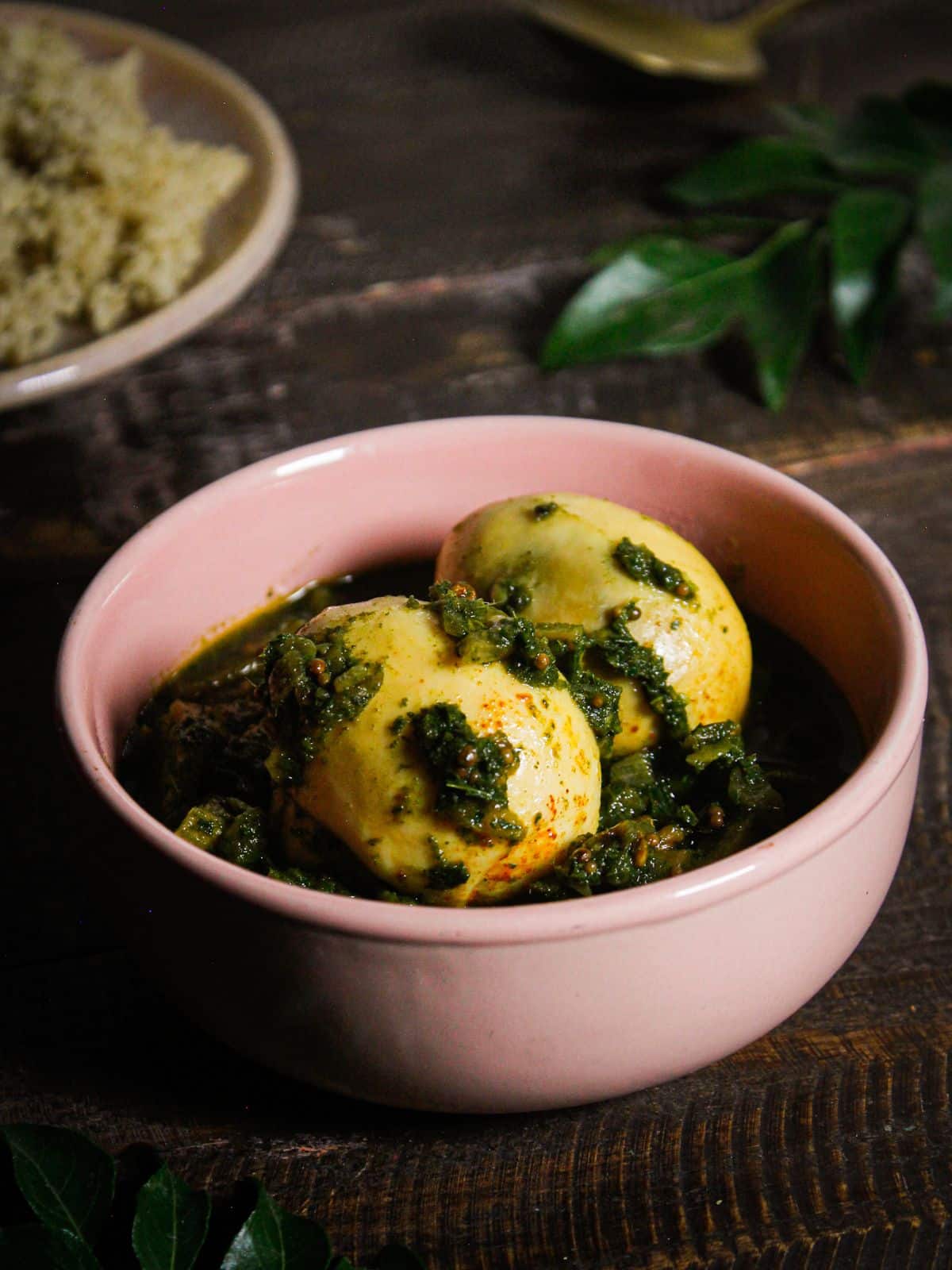 Delicious Egg Curry with Curry Leaves Puree served in a bowl