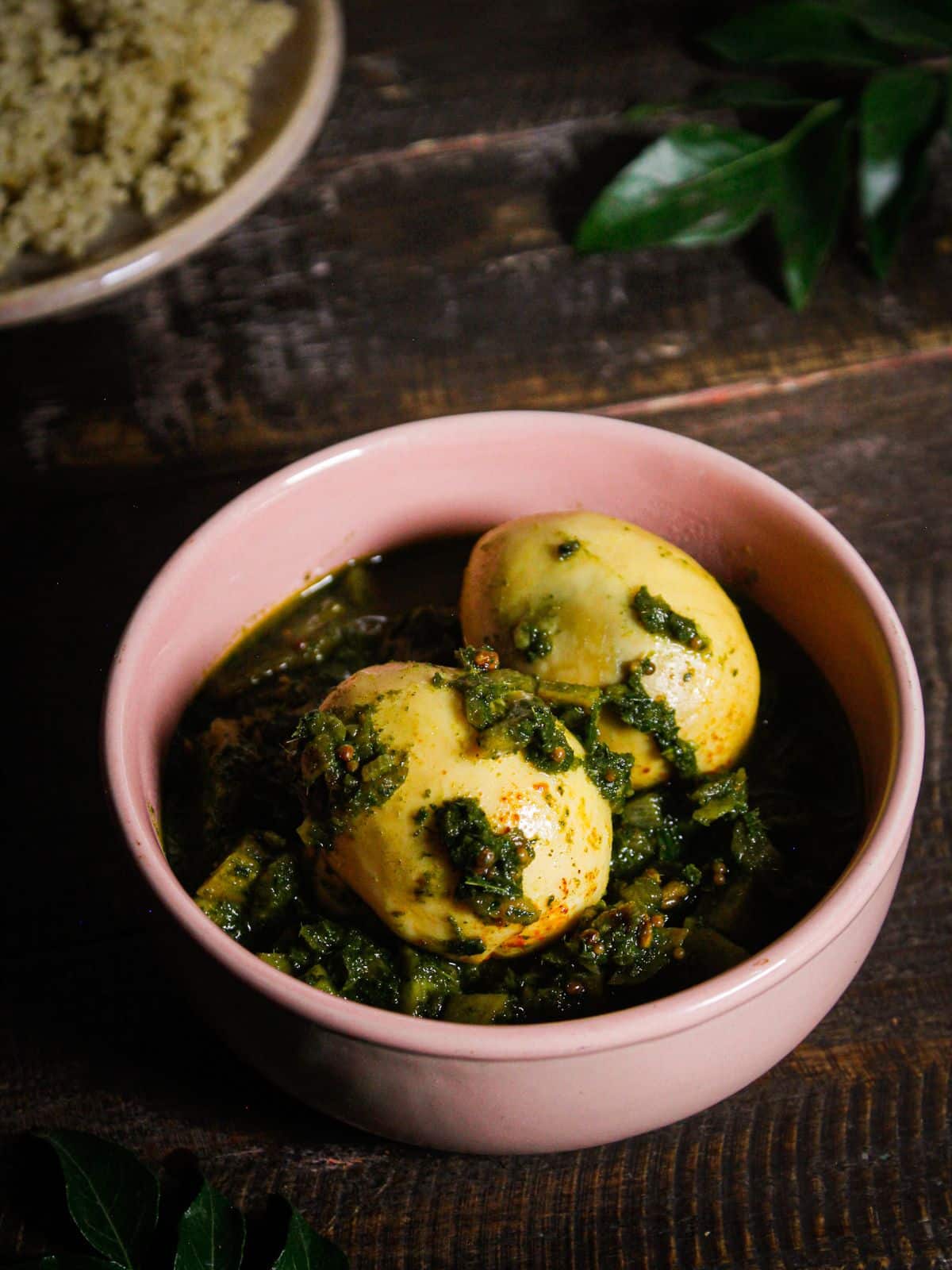 Yummy Egg Curry with Curry Leaves Puree served in a pink bowl