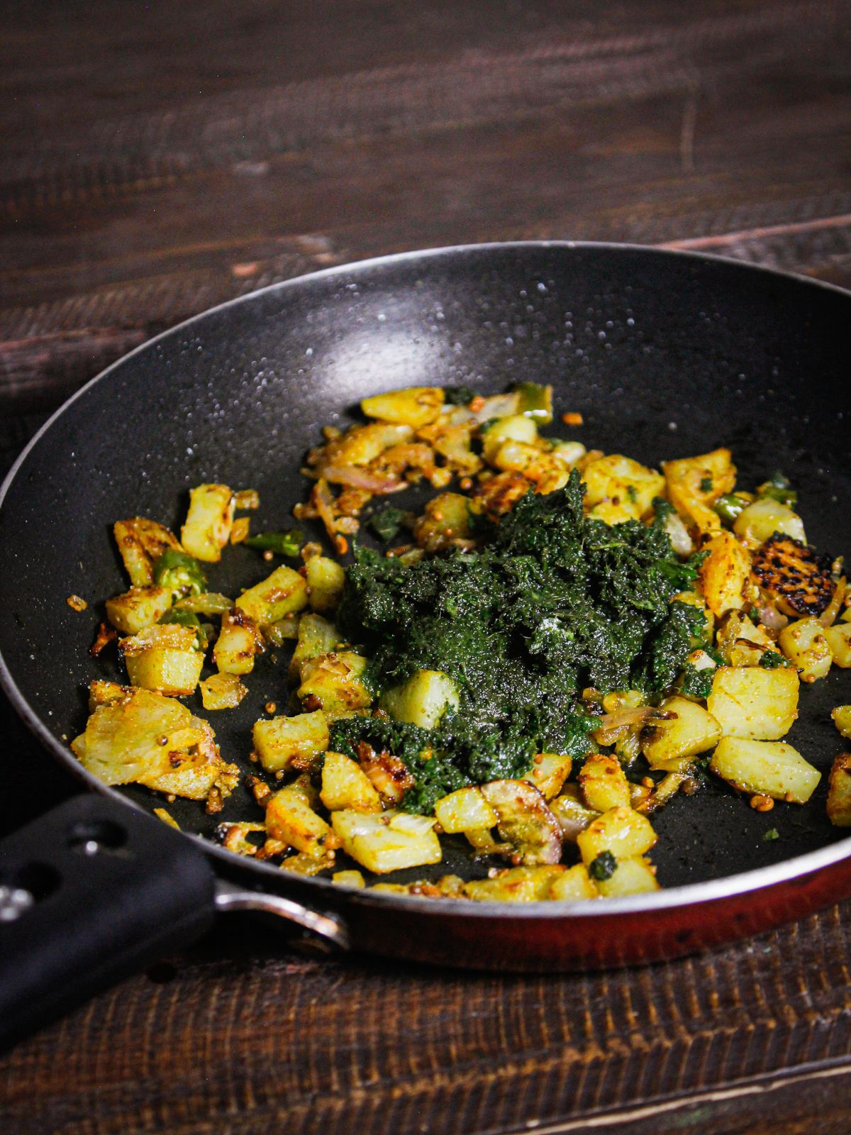 Add curry leaves paste to the pan and mix well