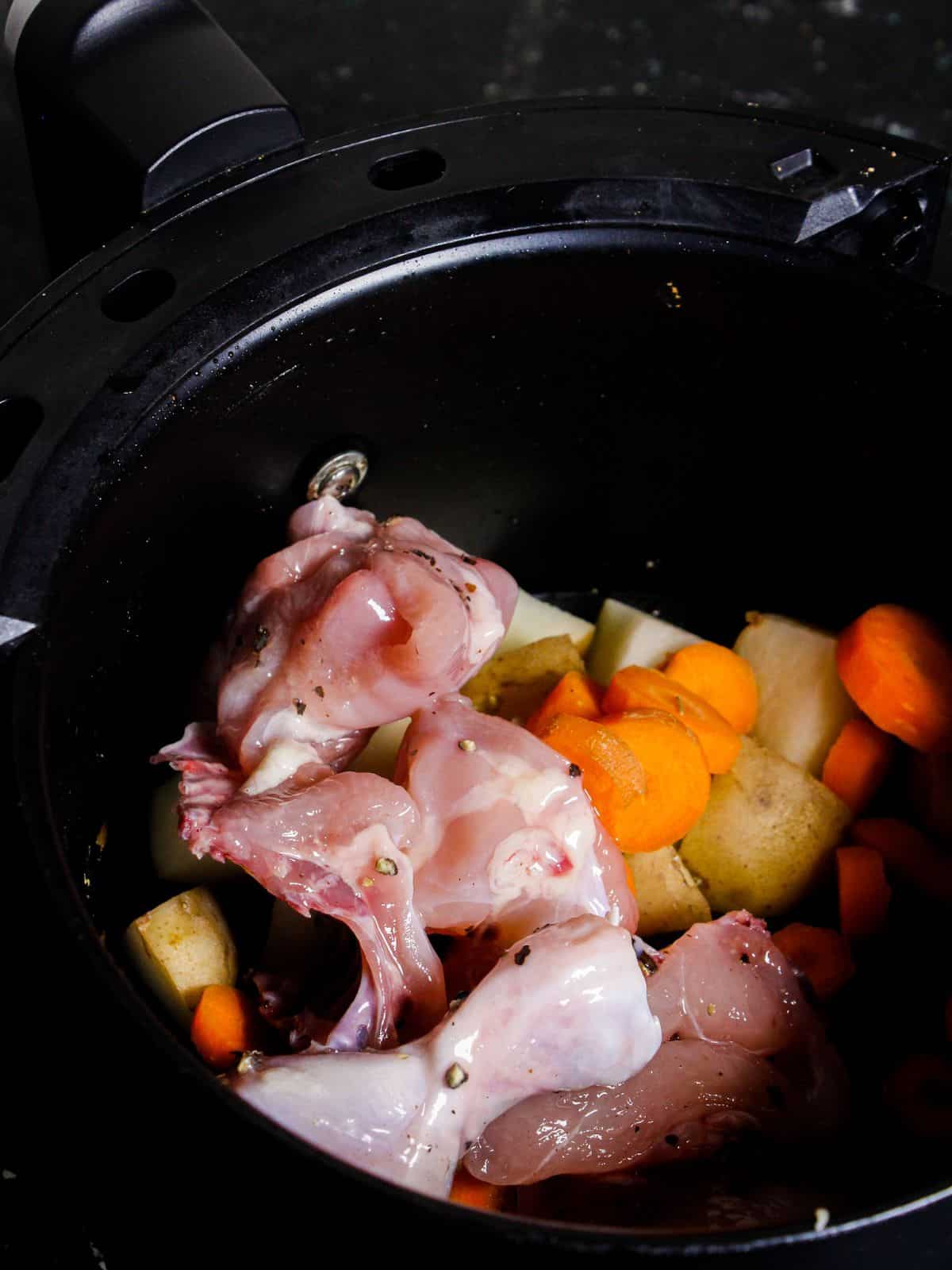 Add marinated chicken along with cubed vegetables into the instant pot and start cooking 