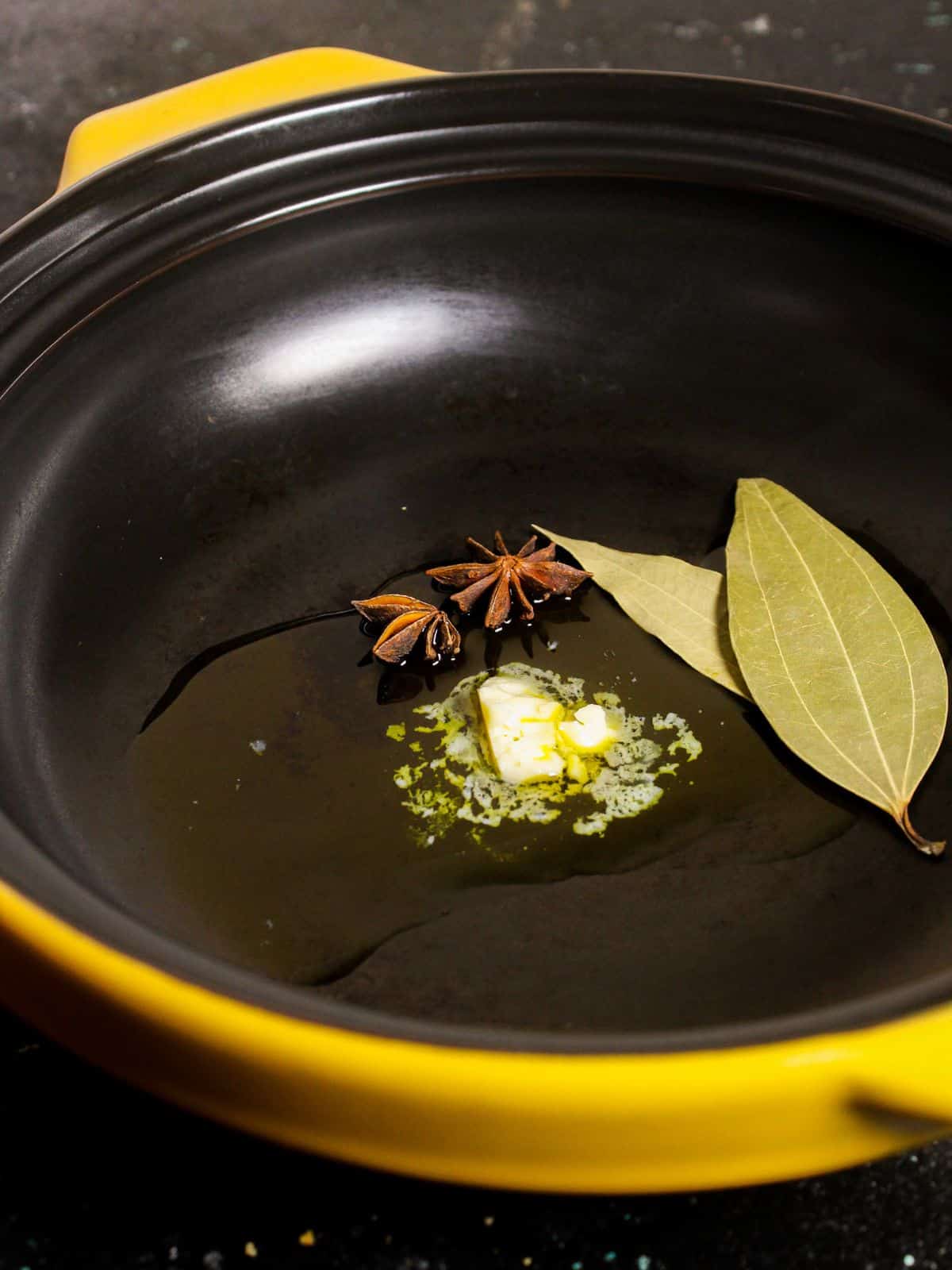 Take butter, bay leaves and star anise in a pan and saute 