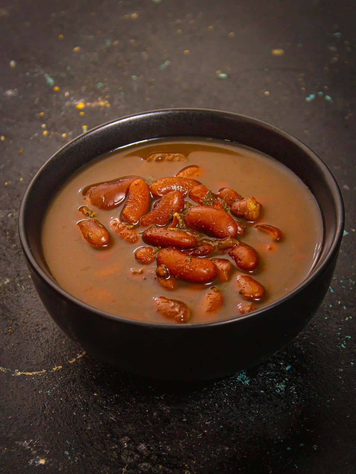 Garnish Instant Pot Mexican Beans Soup with chopped spring onions and enjoy 