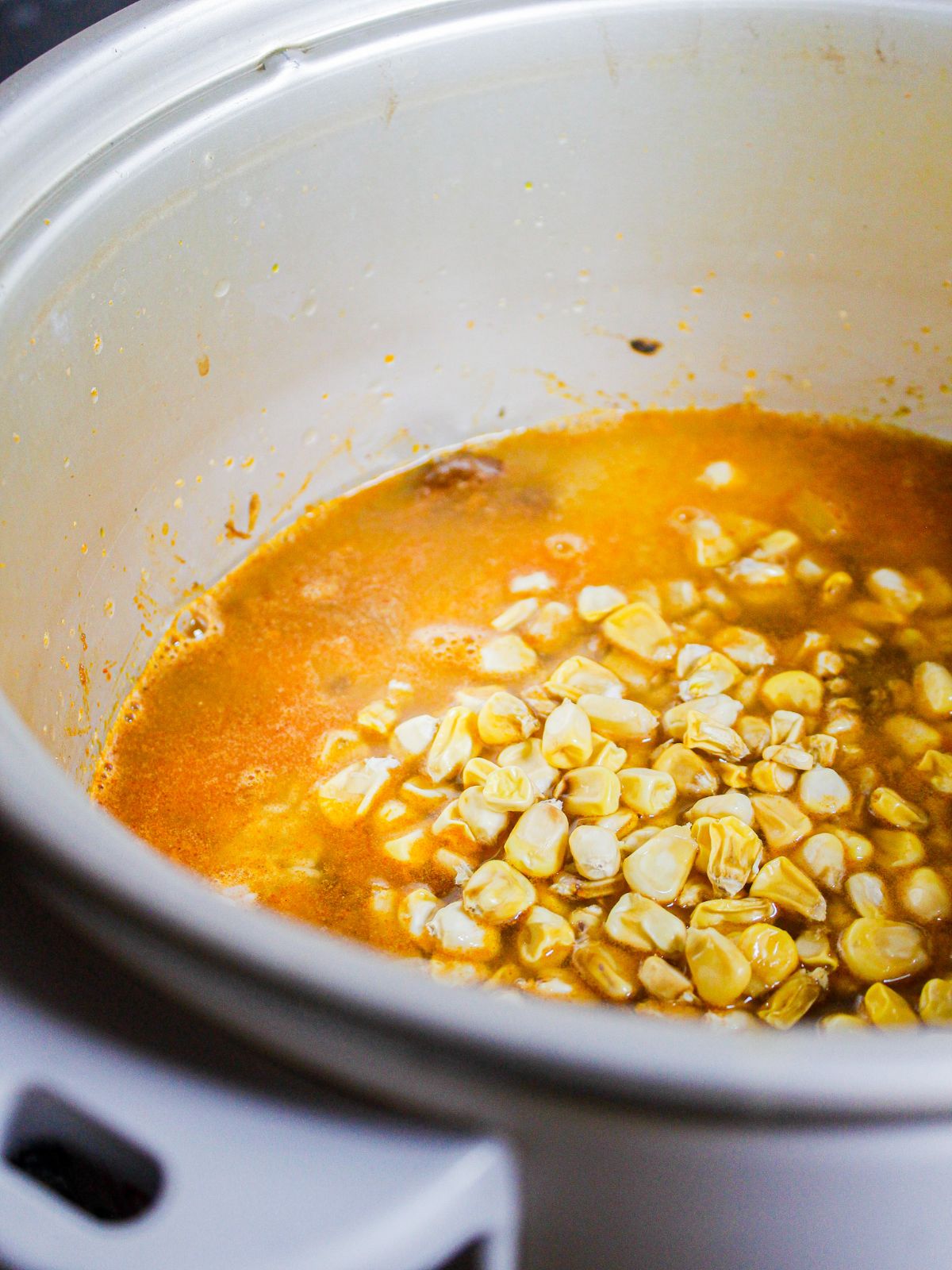 Add corn on top into the instant pot and mix well 