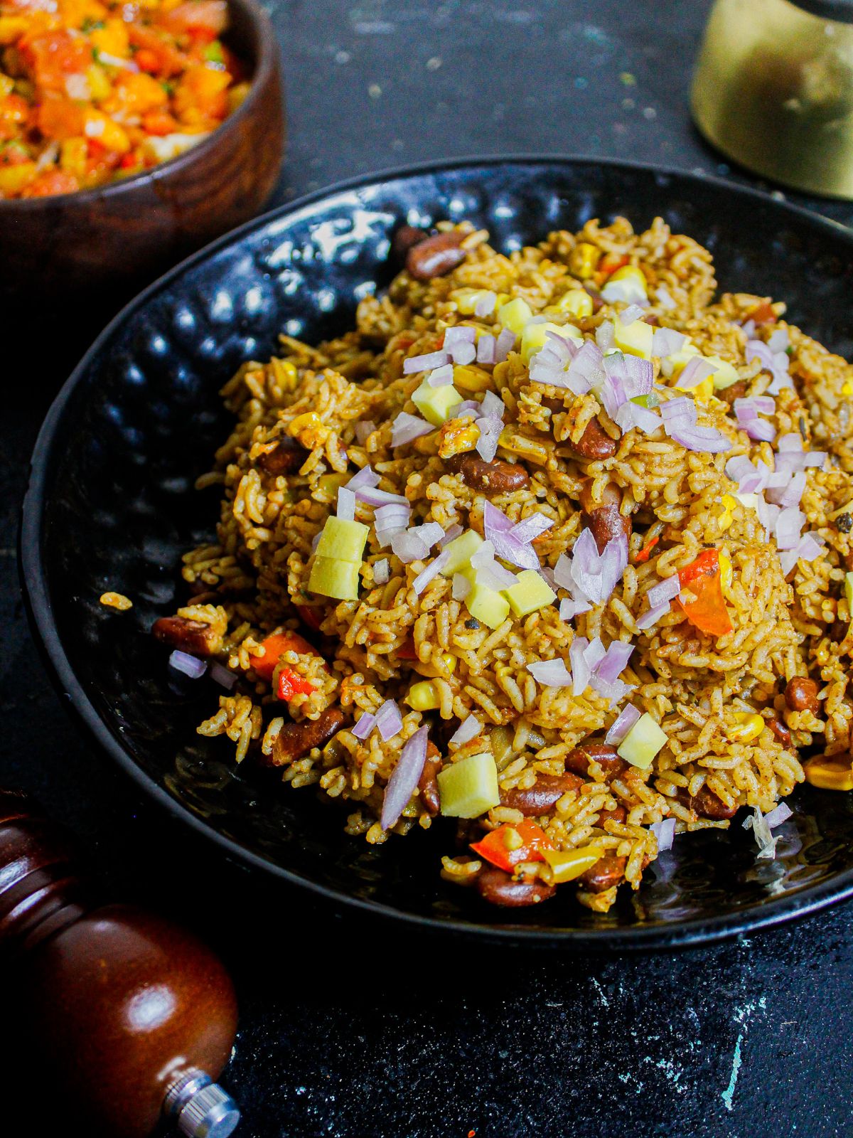 Spicy Instant Pot Mexican Rice served on a black plate 