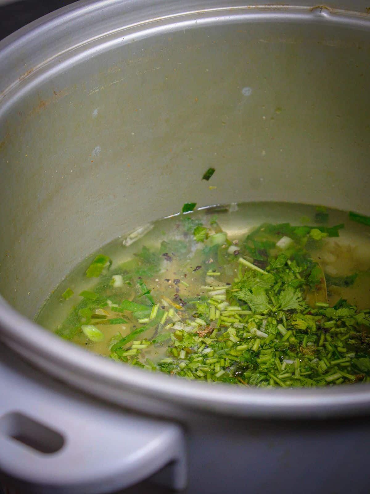 Add chopped coriander leaves to the pot  