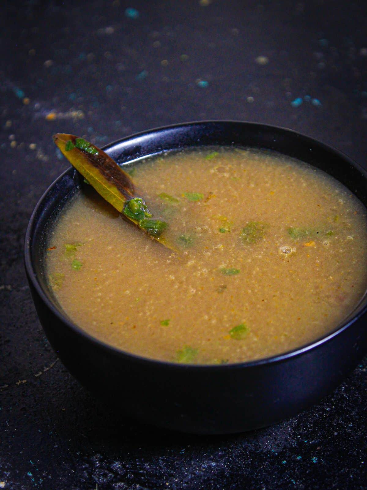 Sprinkle some black pepper over Instant Pot Spring Onion and Coriander Soup