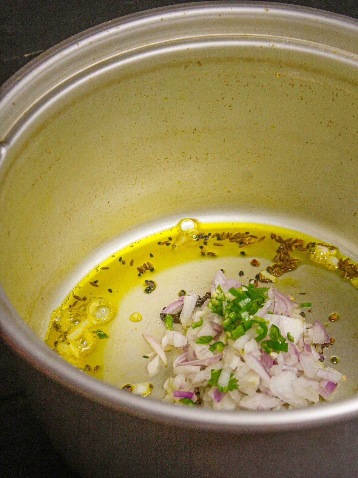 Add chopped onions to the pot and saute well 