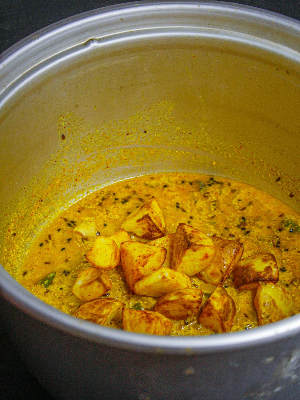 Add air fryed potatoes to the gravy and mix well 