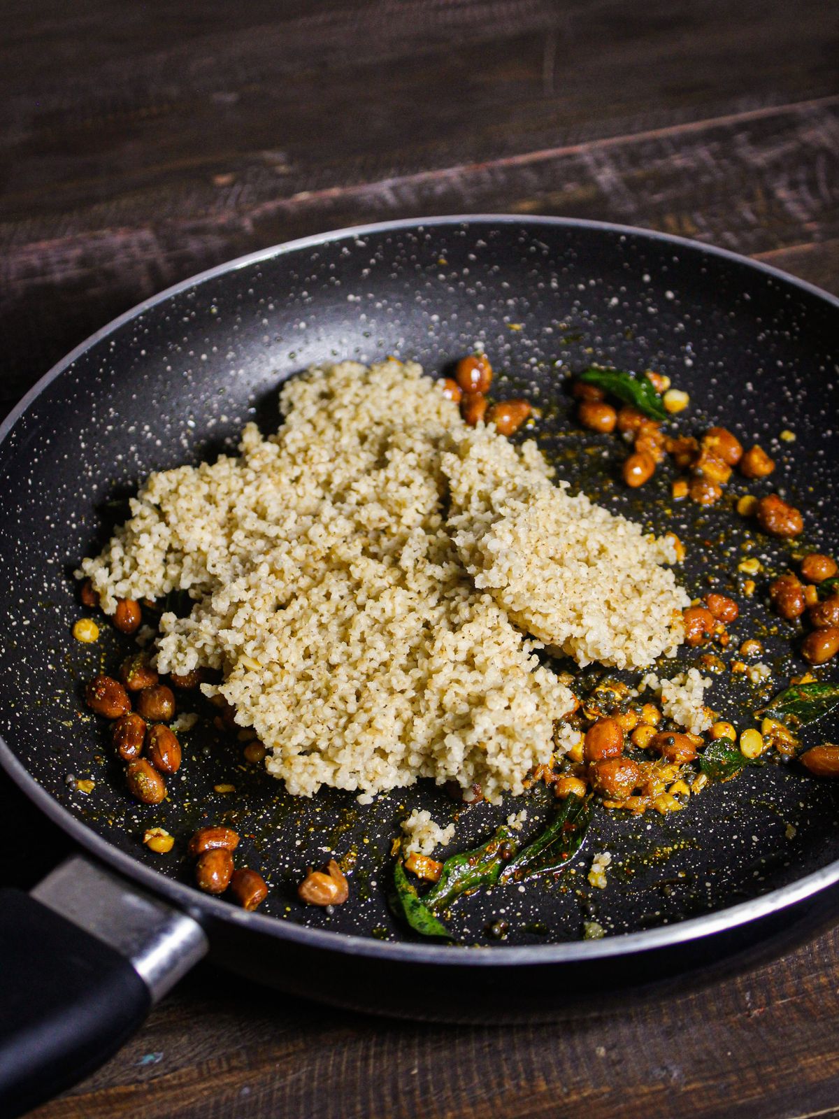 Add cooked millets to the pan 