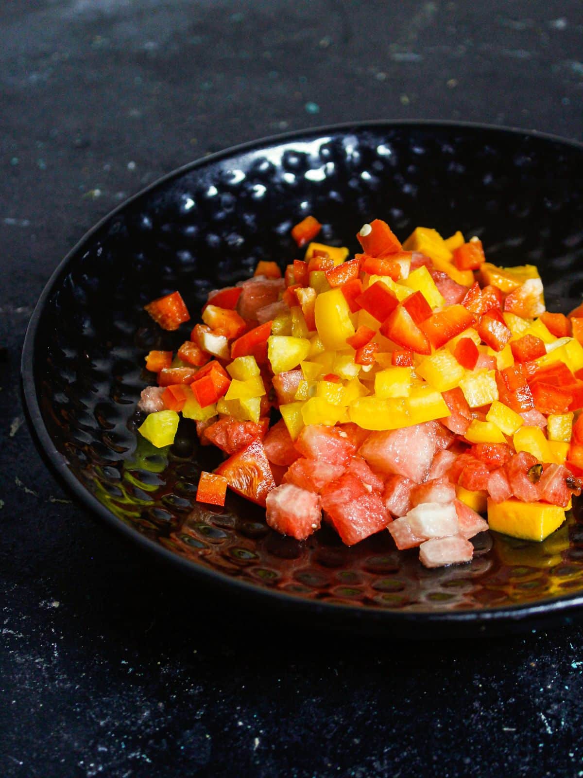 Add chopped red capsicums' onto the saucer 