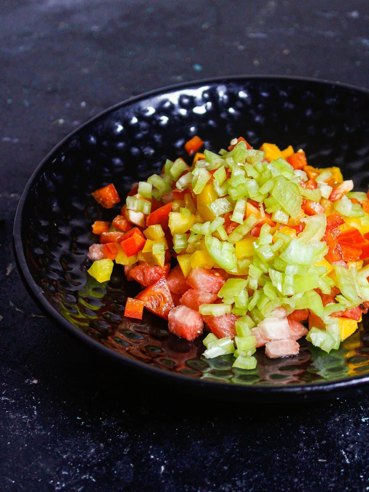 Add chopped green capsicums' onto the saucer 