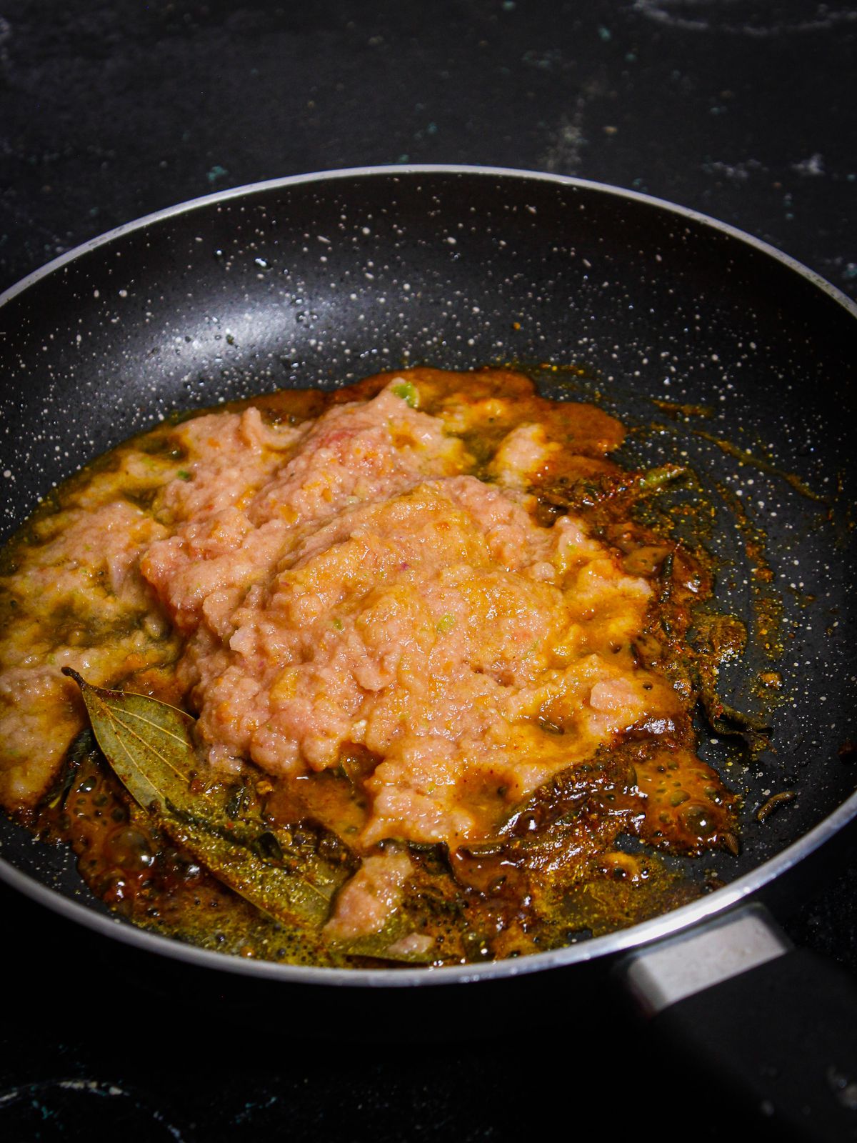 Add tomato mixture over the pan and mix well 