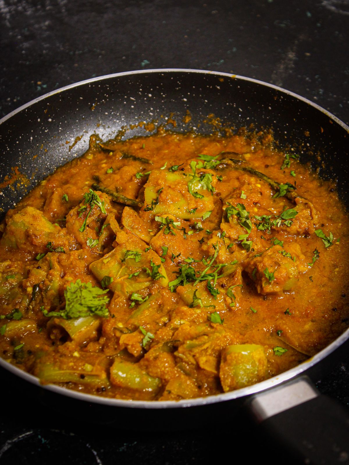 Garnish Mirchi Bhajji Curry with chopped coriander leaves and serve hot with rice or rotis  