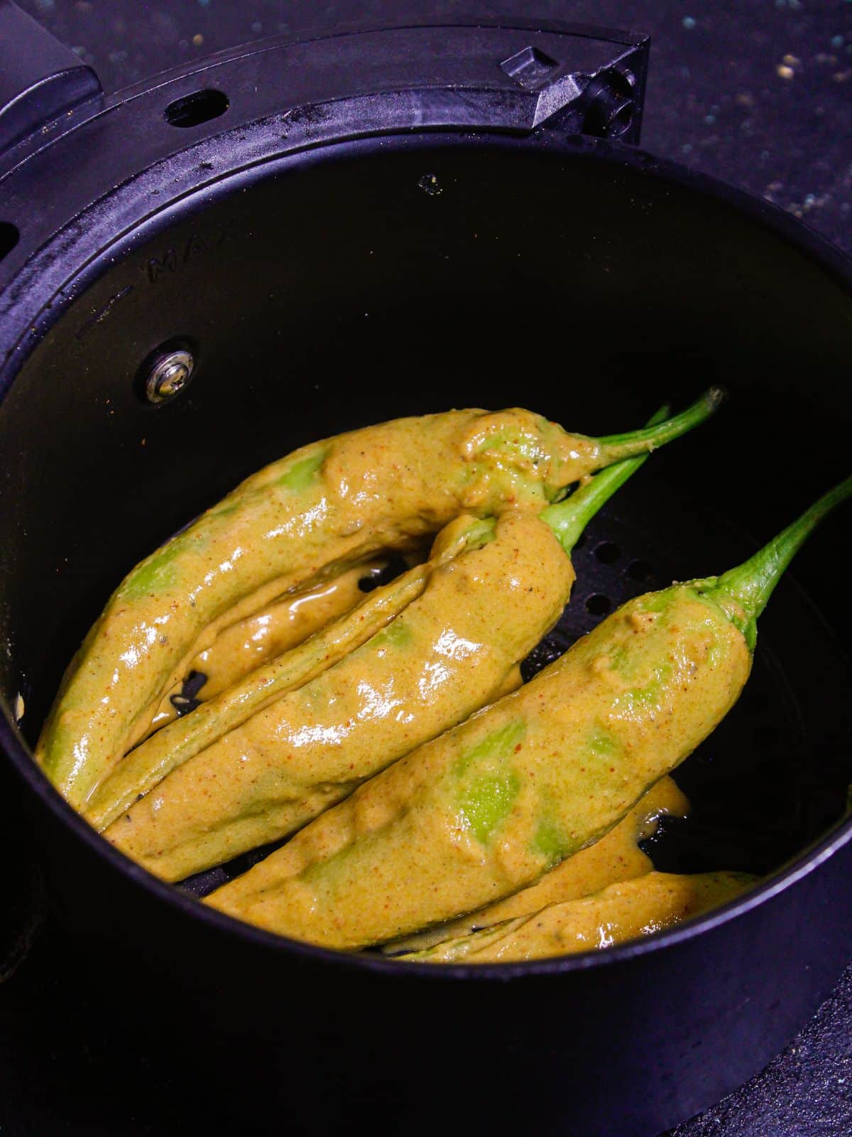 Air fry the chilies until its crunchy from all the sides  