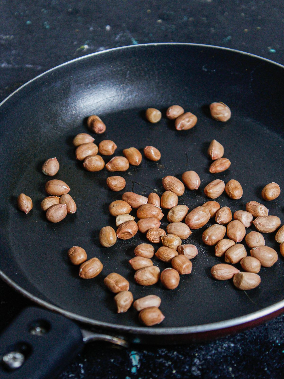 Roast some peanuts in a pan