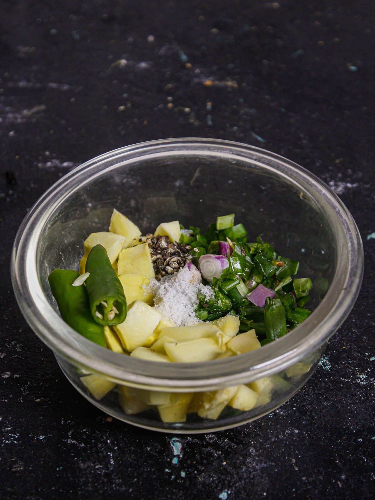 Add all the ingredients of Spring Onion Raw Mango Chutney in a bowl