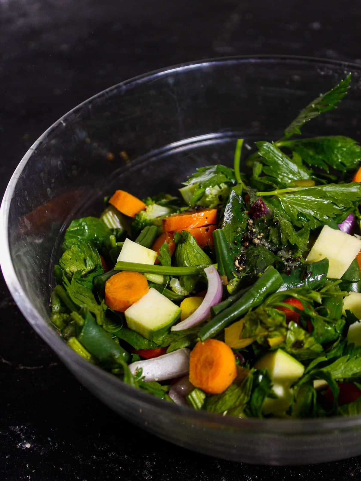 Pour the dressing mixture over the vegetable mixture on the bowl 