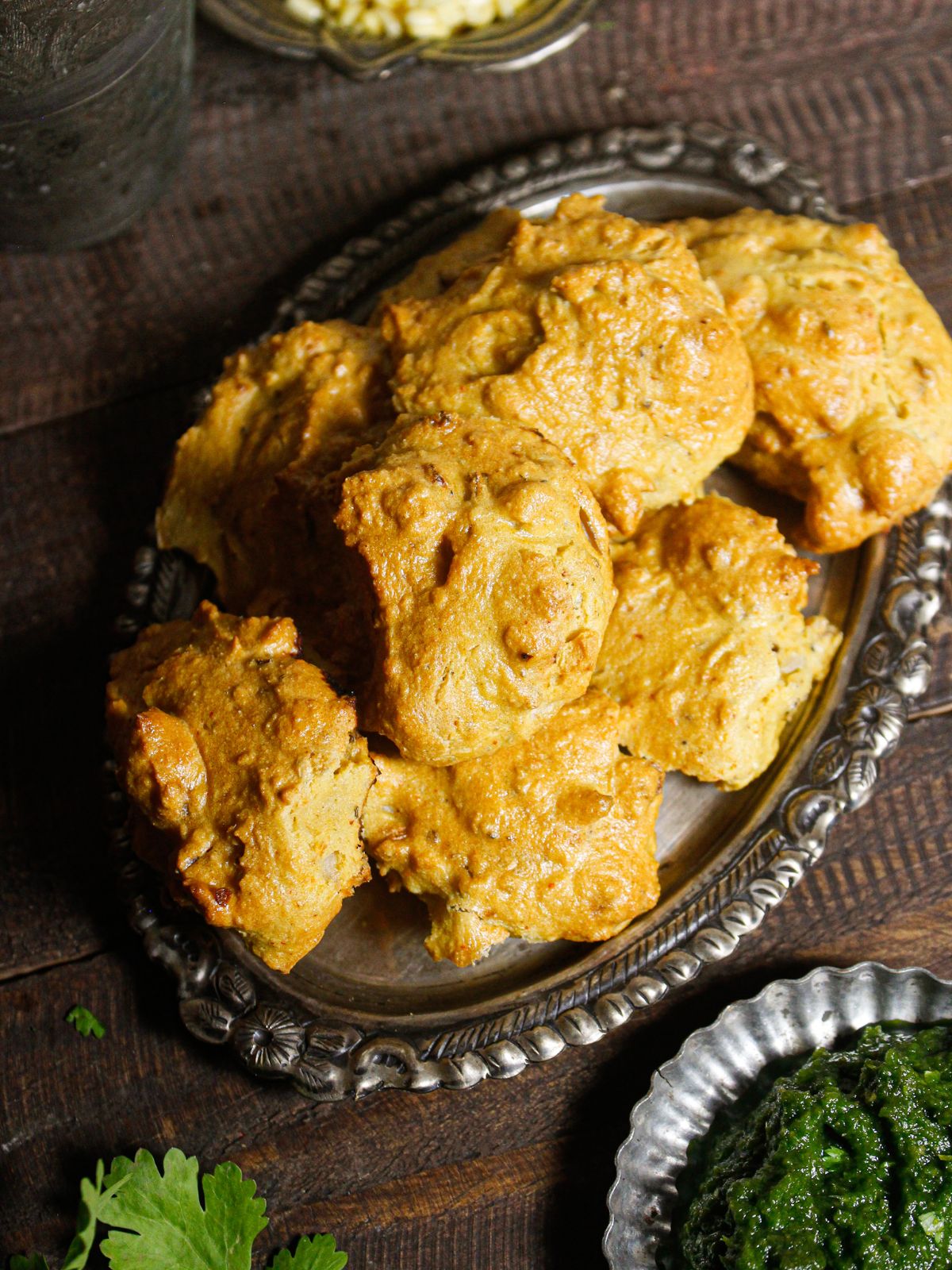 Delicious Air Fried Moong Dal Vada With Green Chutney on a silver platter 