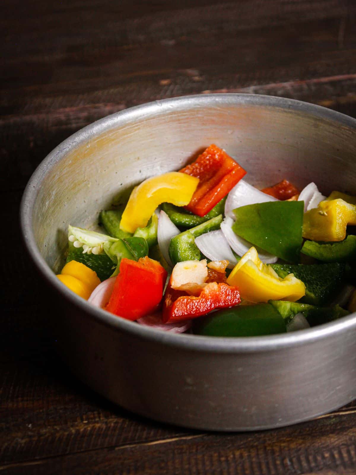 Take chopped vegetables in a vessel