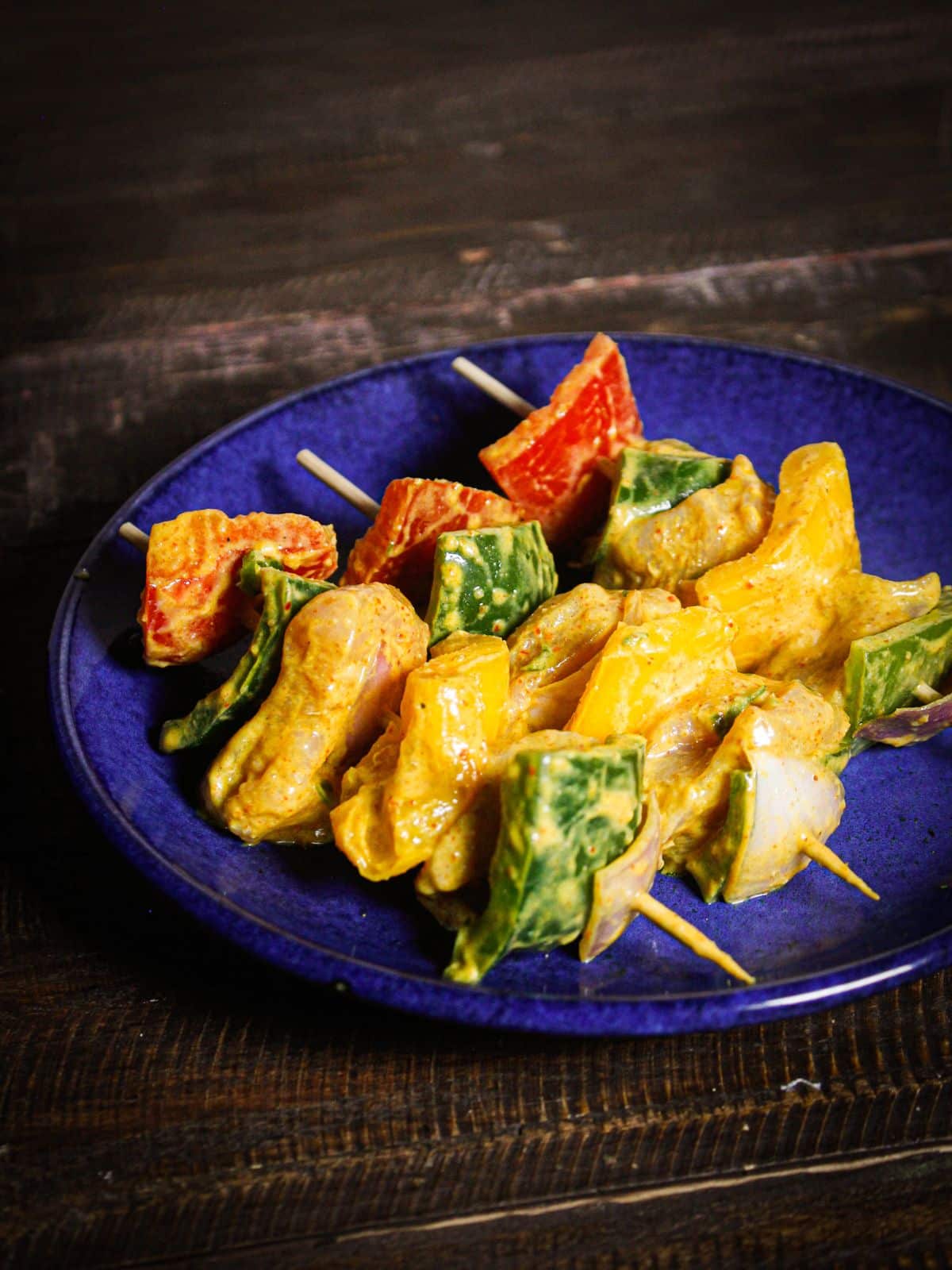 Insert marinated vegetables and chicken pieces into the skewers according to the shape and sizes