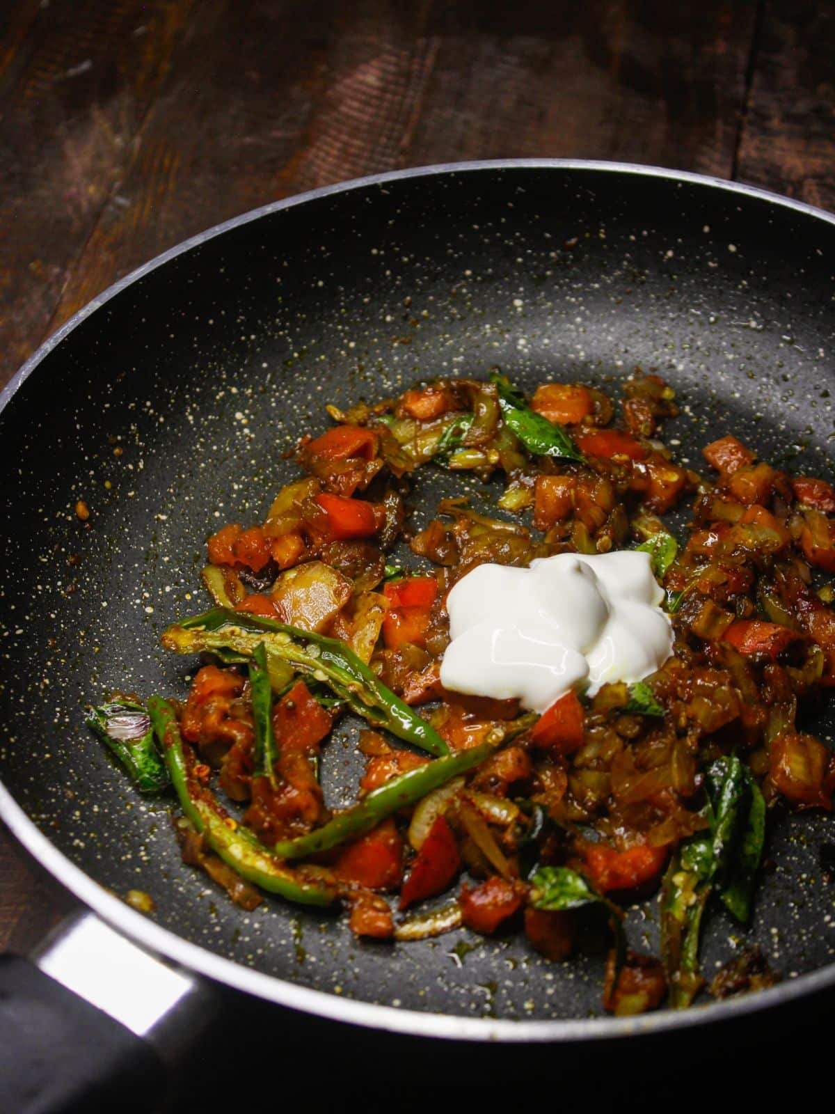 Add coconut milk and water into the pan 