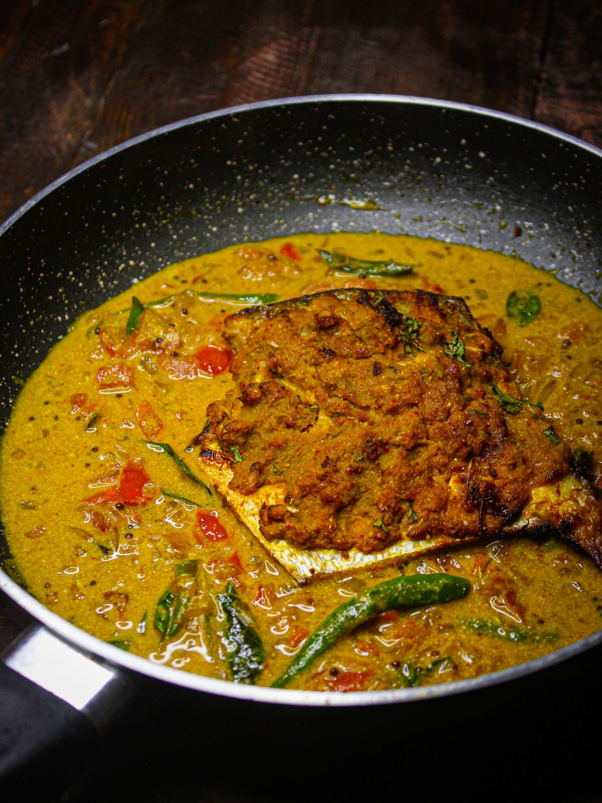 Add air fried fish into the curry and cook 