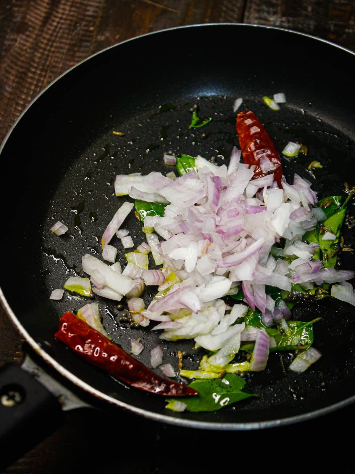 Add chopped onions to the saute 
