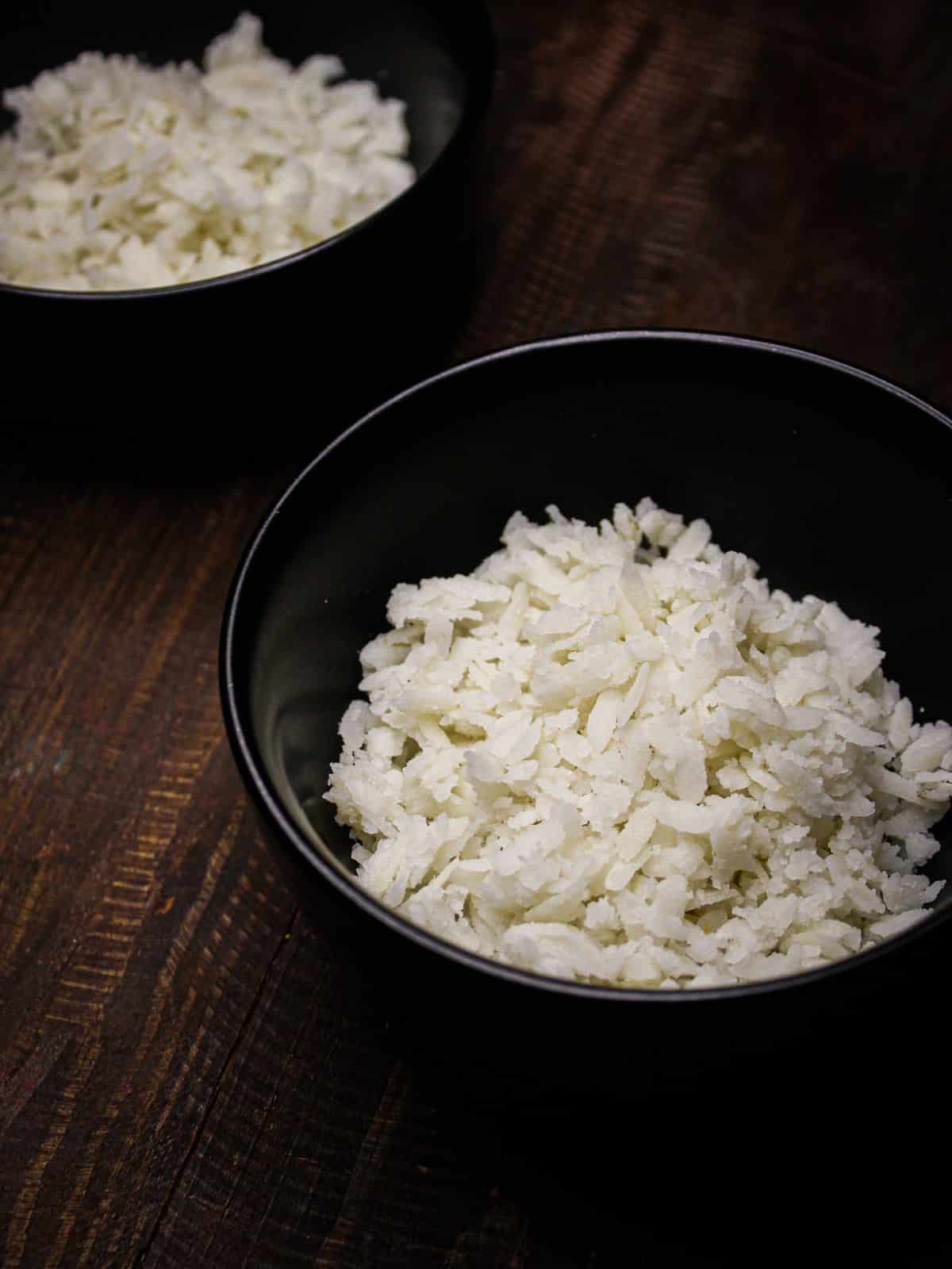 Squeeze flattened rice and distribute it into 2 different bowls 