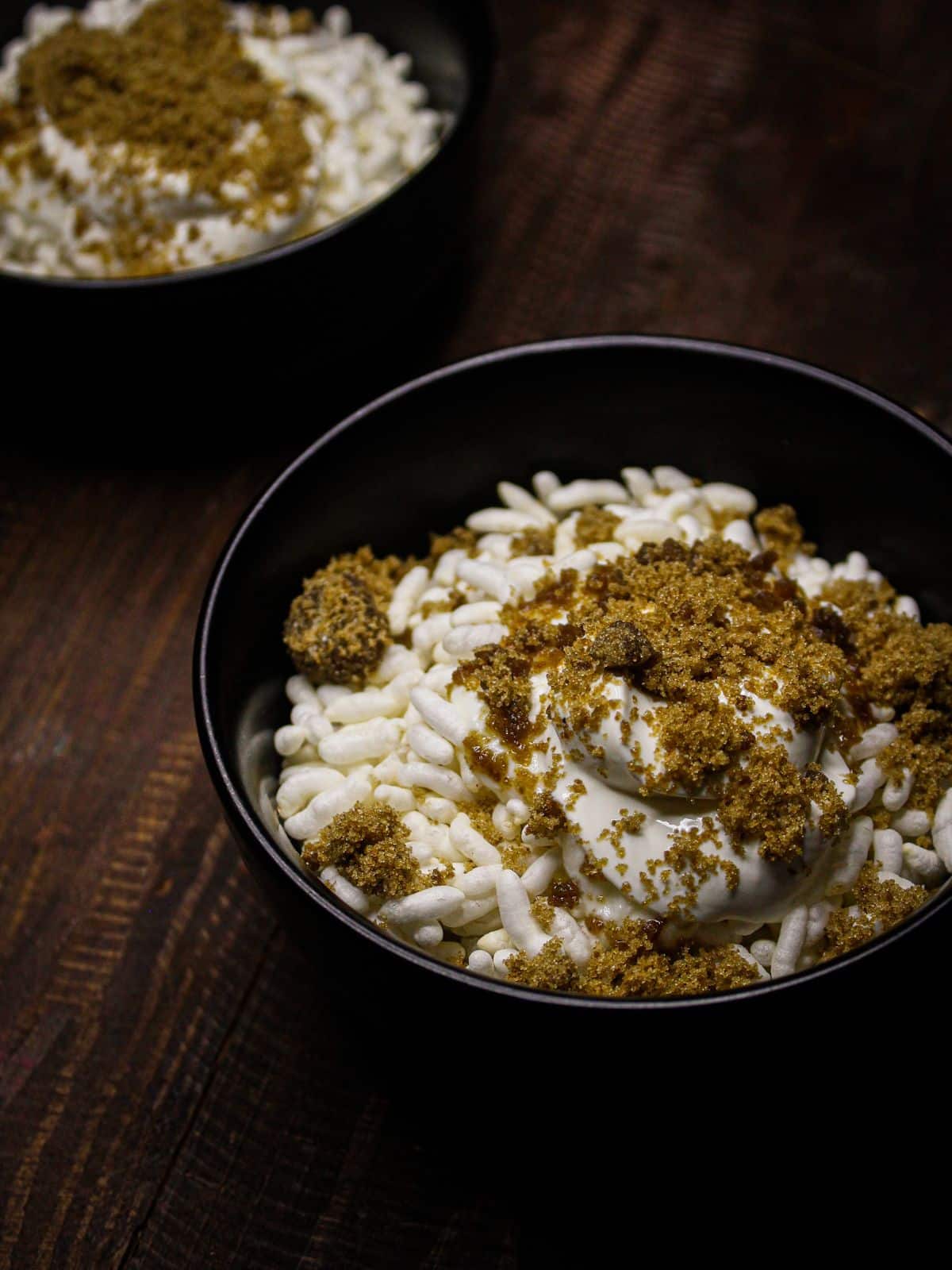 Add jaggery on top of both the bowls and enjoy Doi Chida  