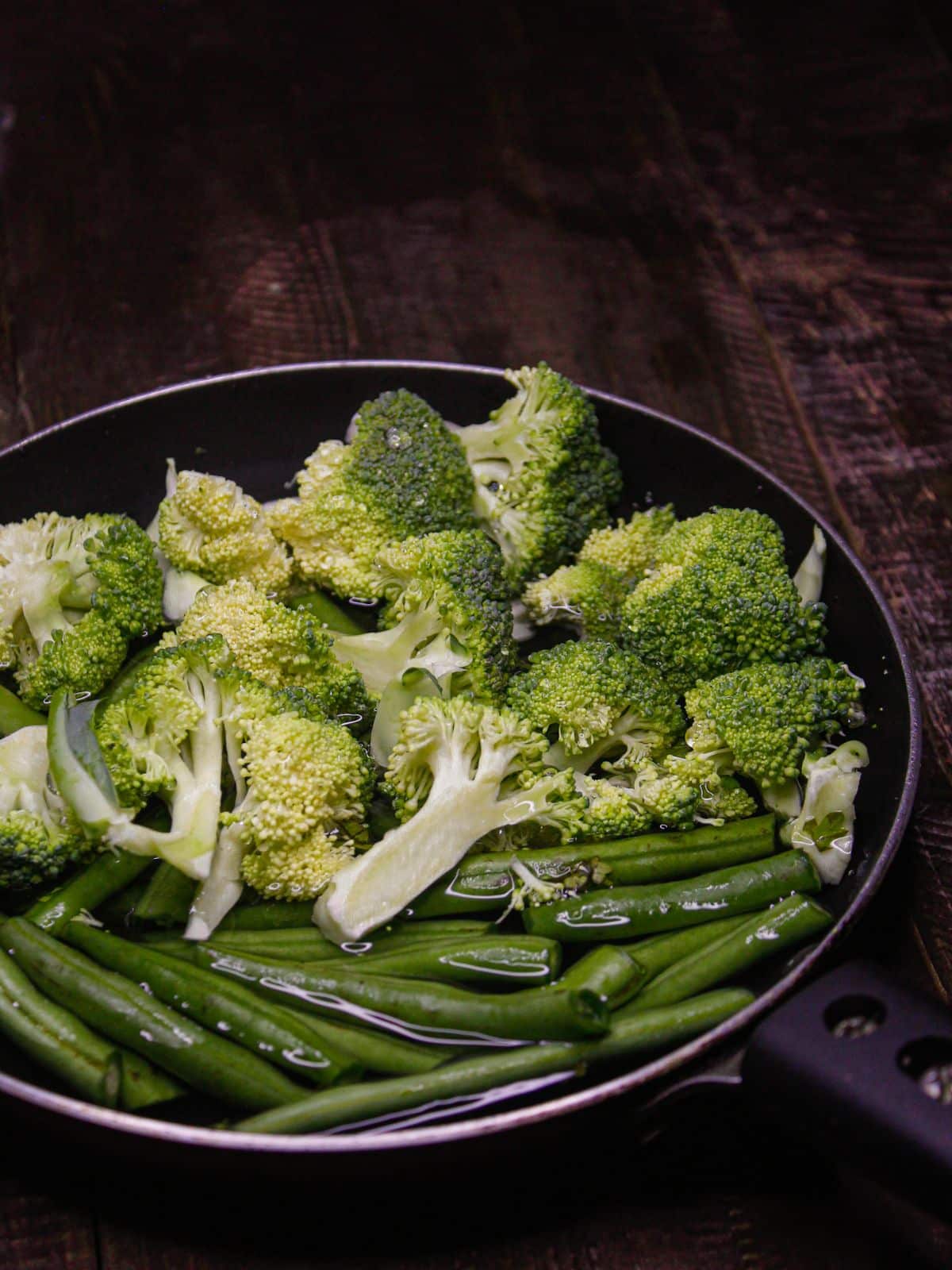 Blanch broccoli and haricot beans 