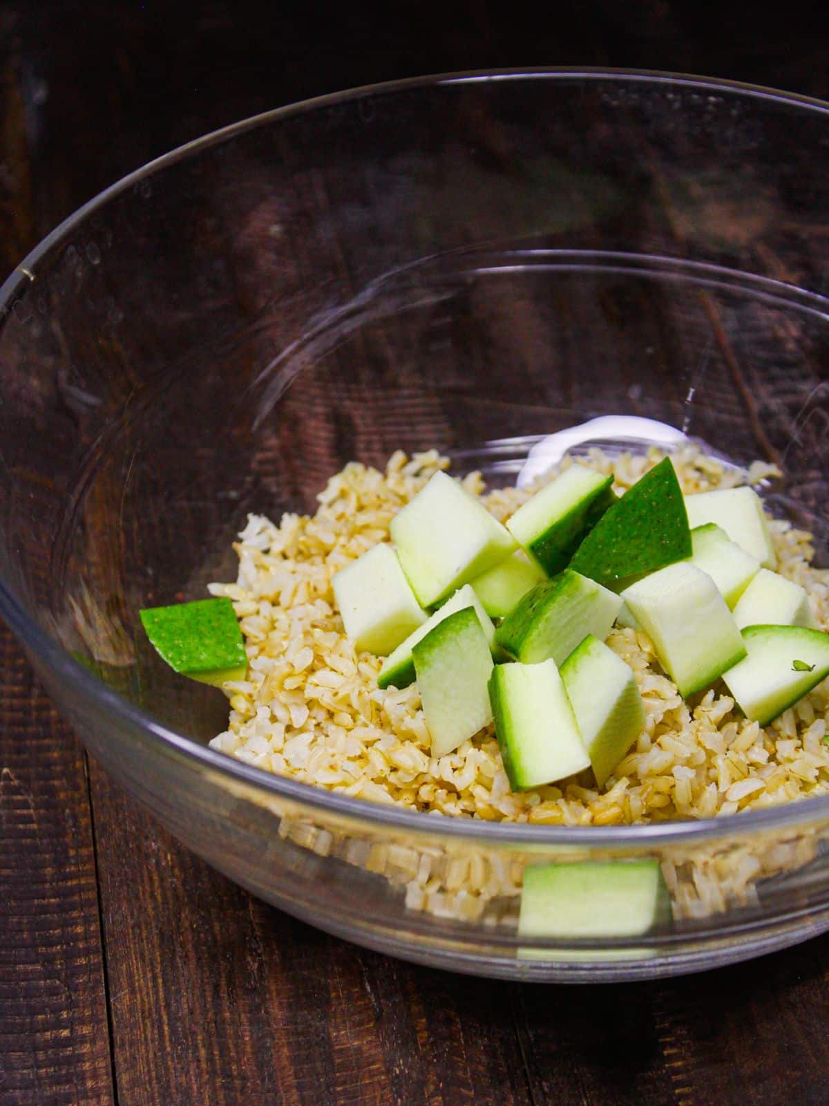 Add chopped raw mangoes to the bowl 