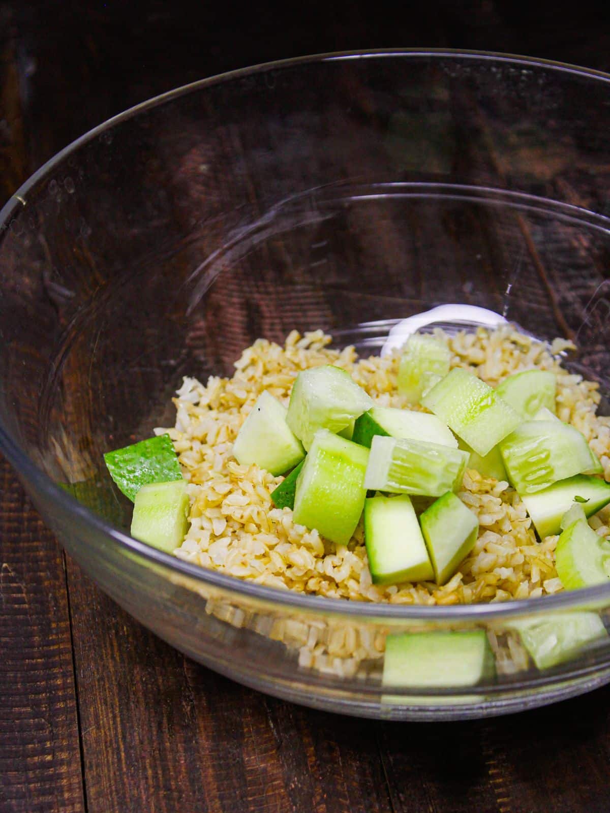 Add chopped cucumber to the bowl