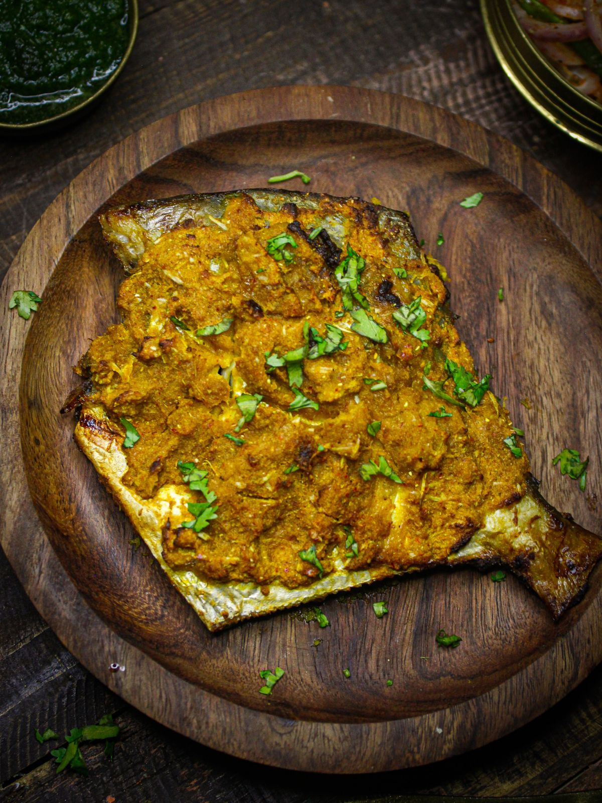 Crisp Kerala Style Air Fried Fish Masala served with chutney as side dish 