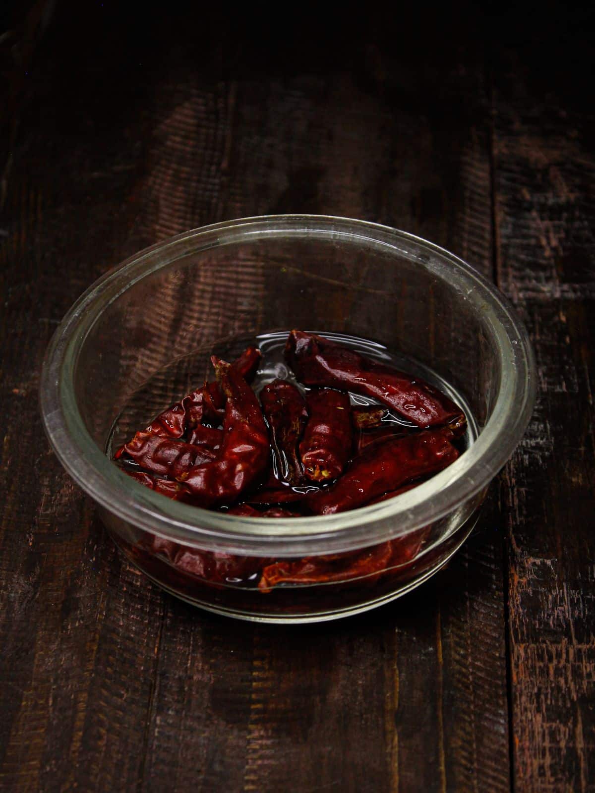 Soak red chilies into a bowl