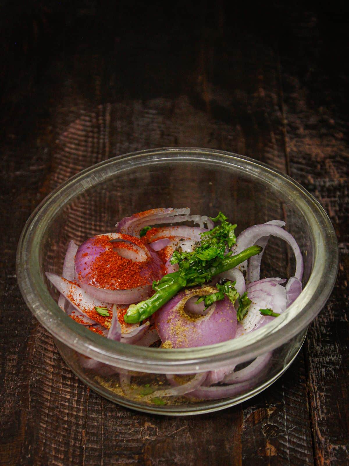 Take all the ingredients for onion salad in a bowl 