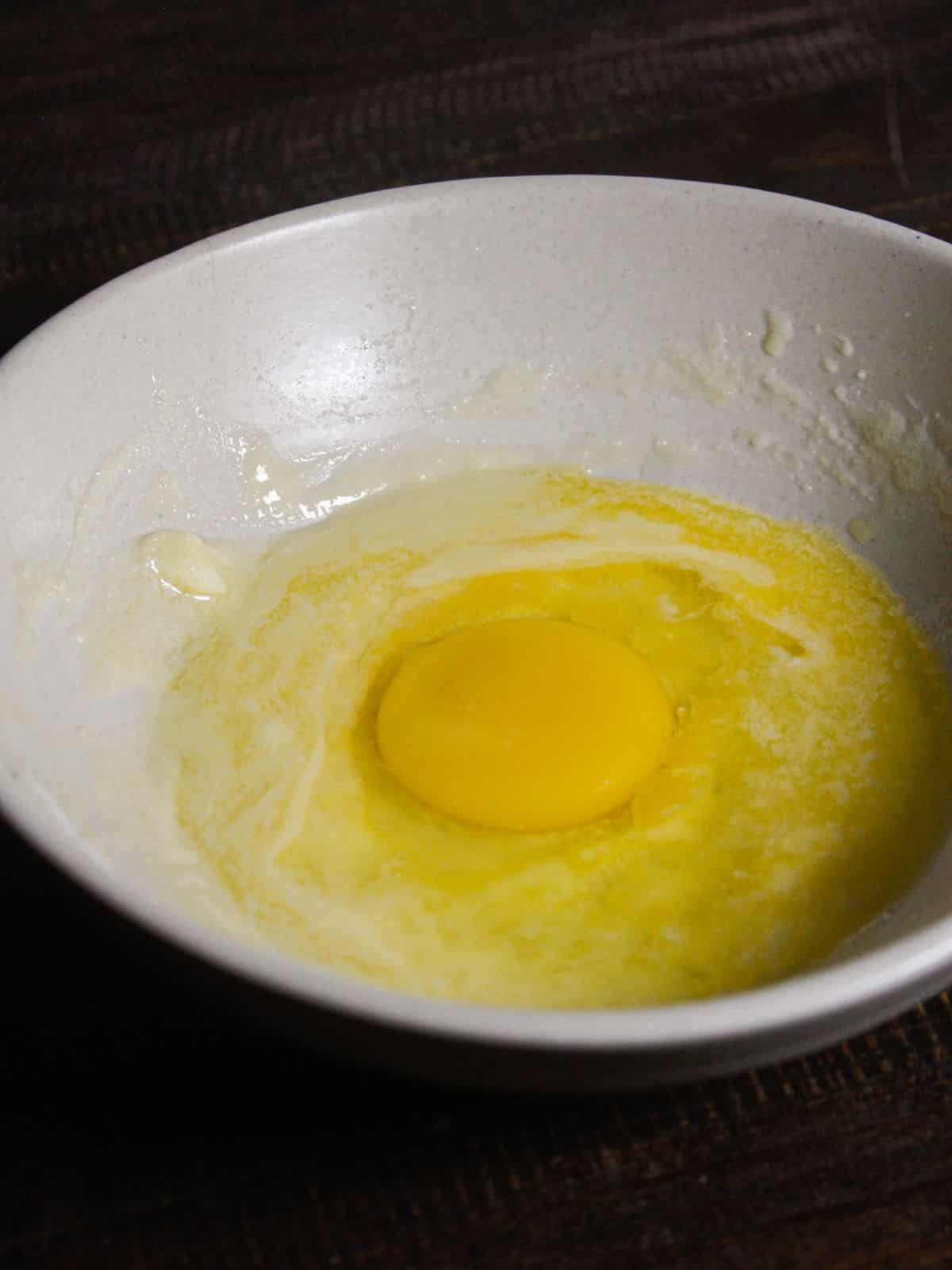 Add egg to the bowl and mix well 