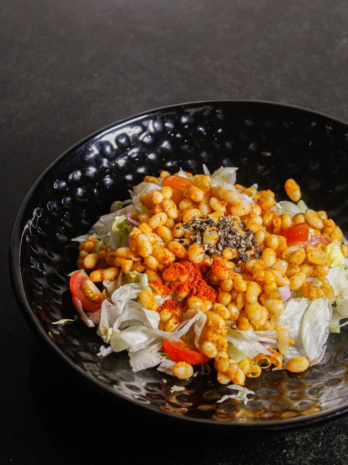 Add all the other ingredients of the salad in a pan and mix well