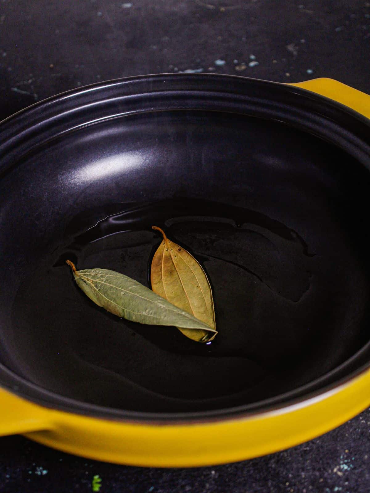 Add bay leaf in a pan and let them crackle 