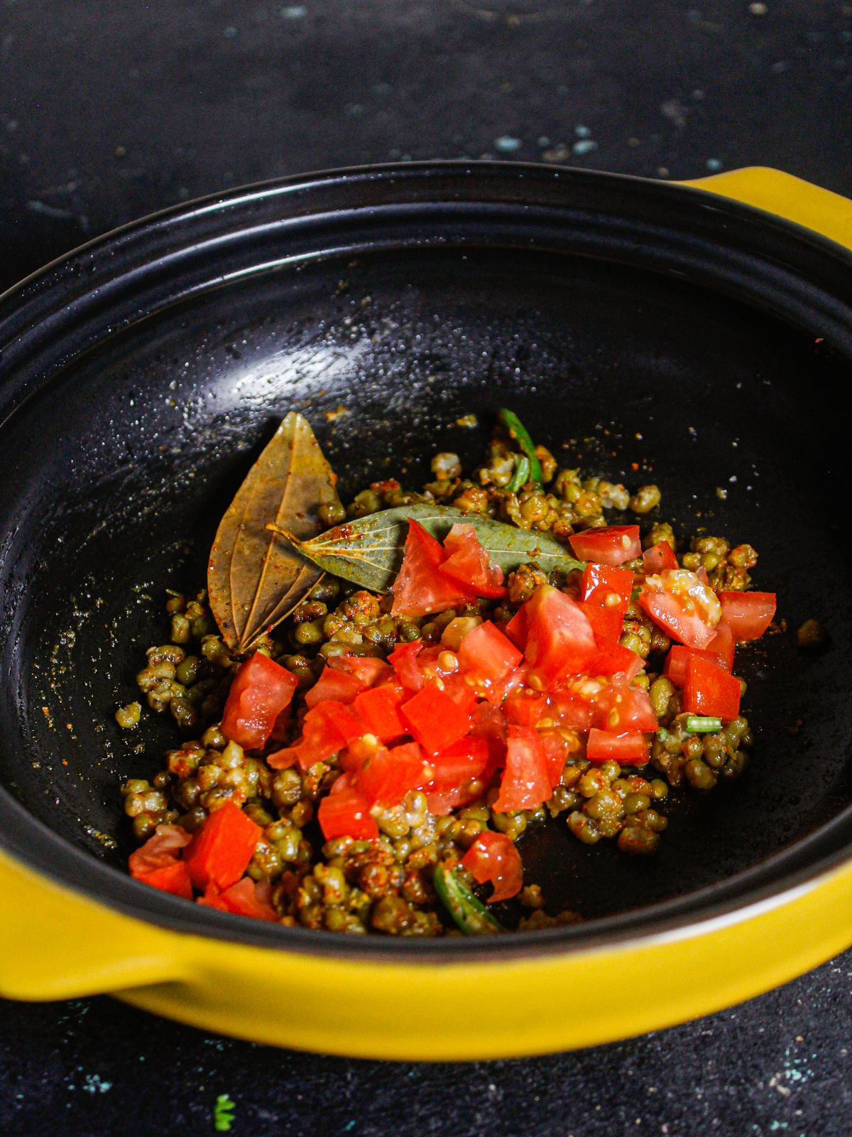 Add chopped tomatoes to the pan 