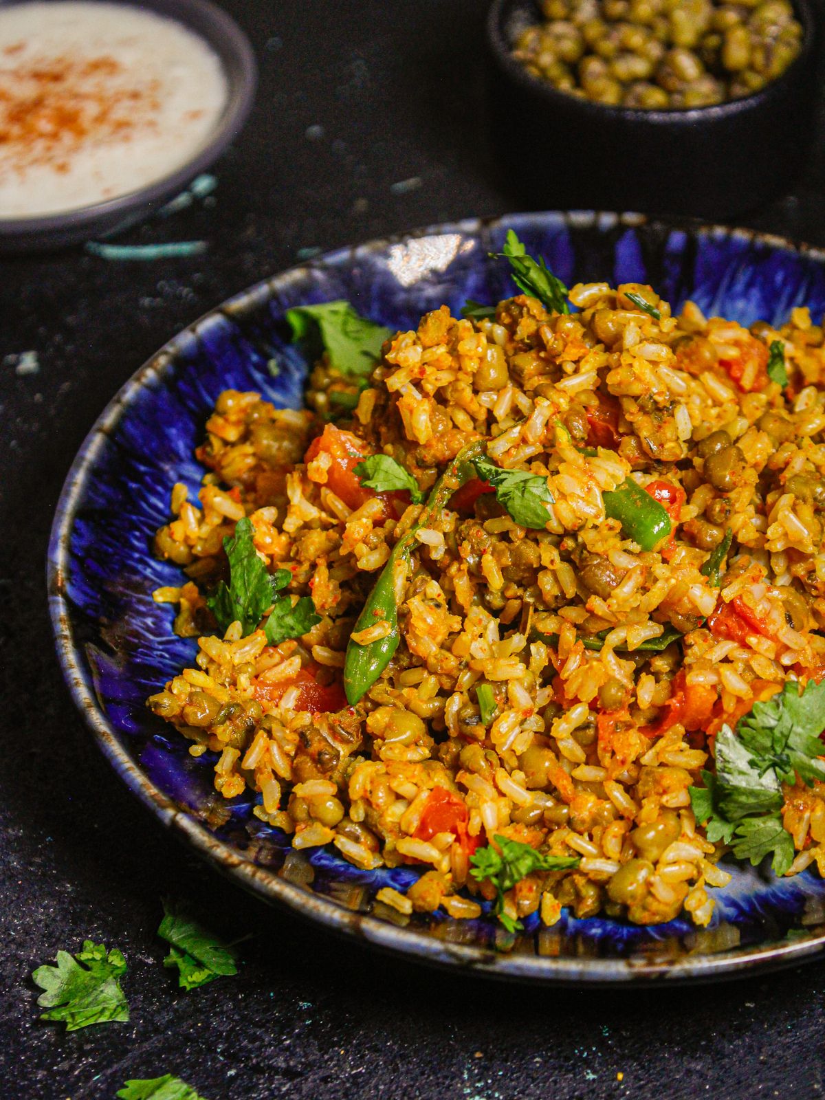 Garnish Brown Rice Green Moong Pulao with coriander leaves and serve hot