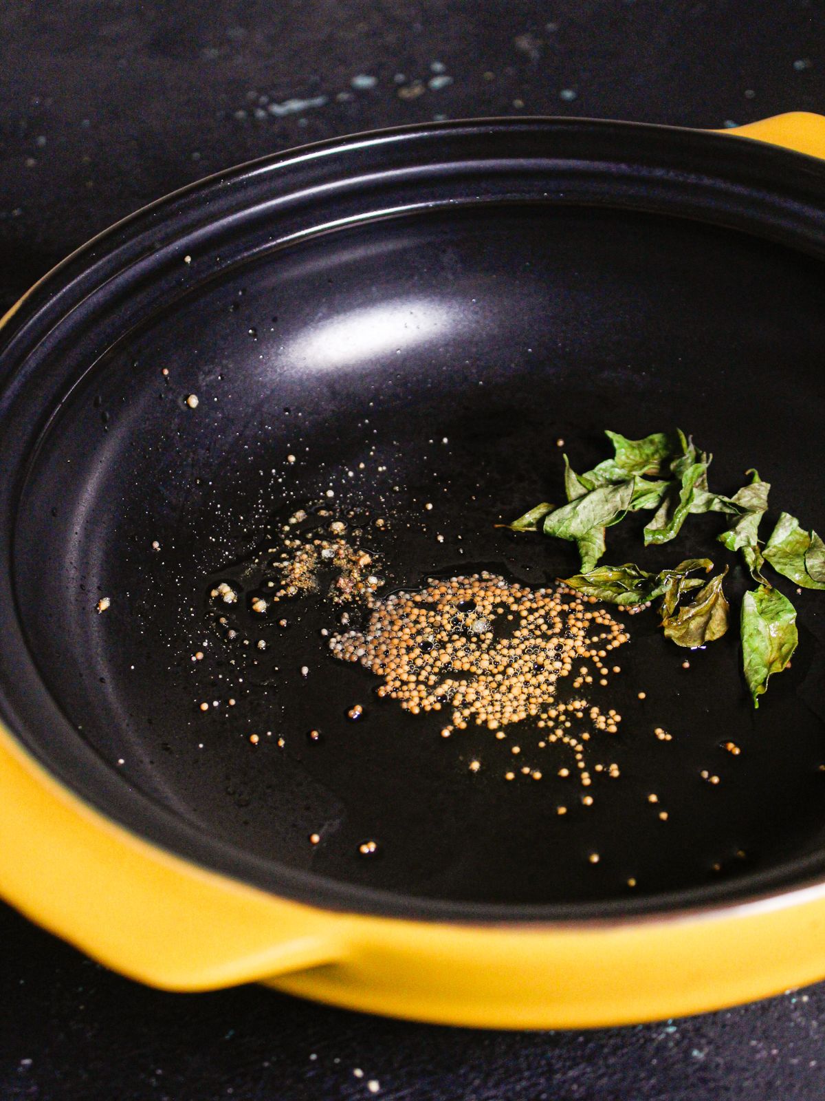 Add mustard seeds, hing, curry leaves and oil in a pan 