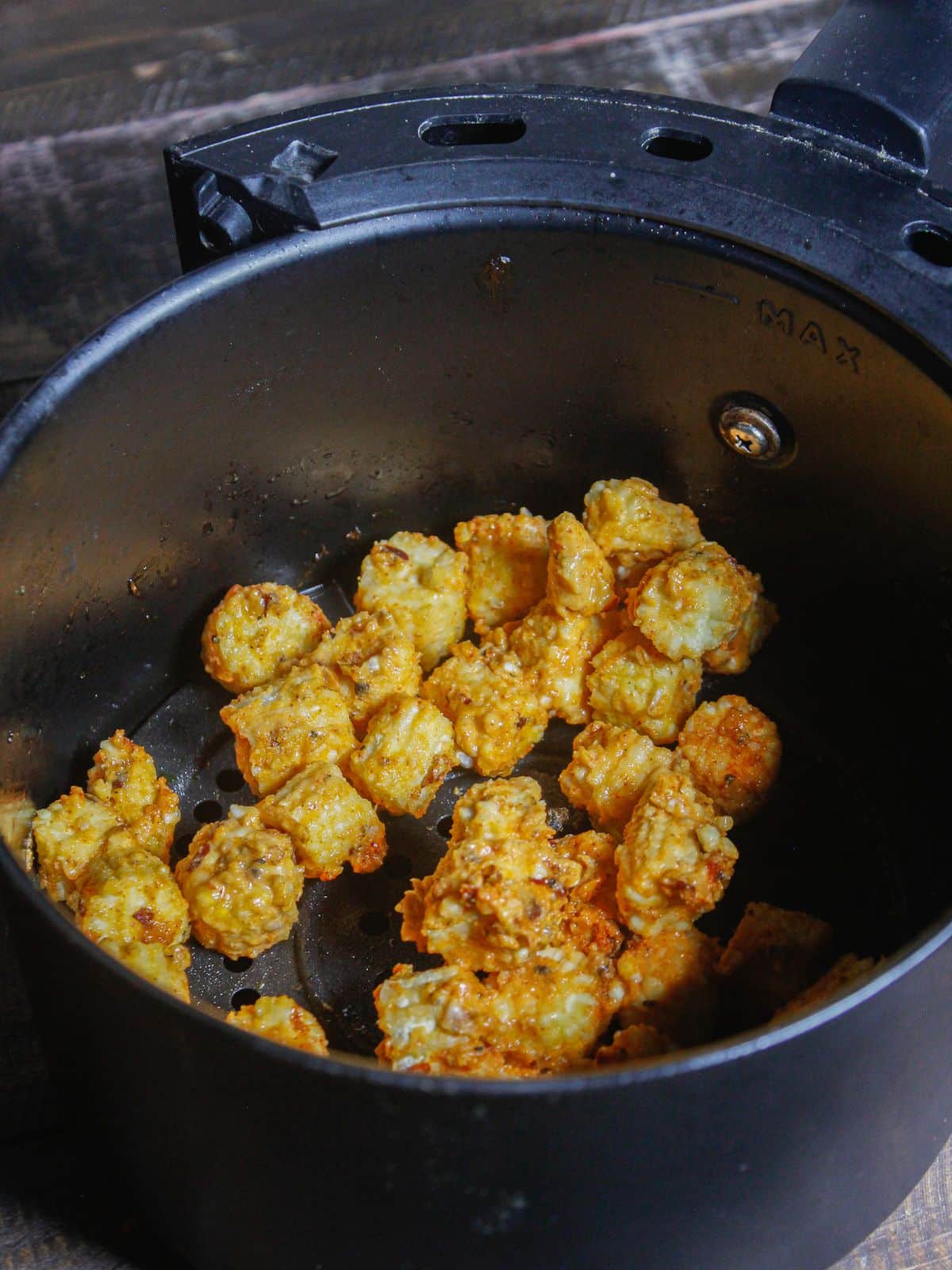 Transfer the coated corn into air fryer 