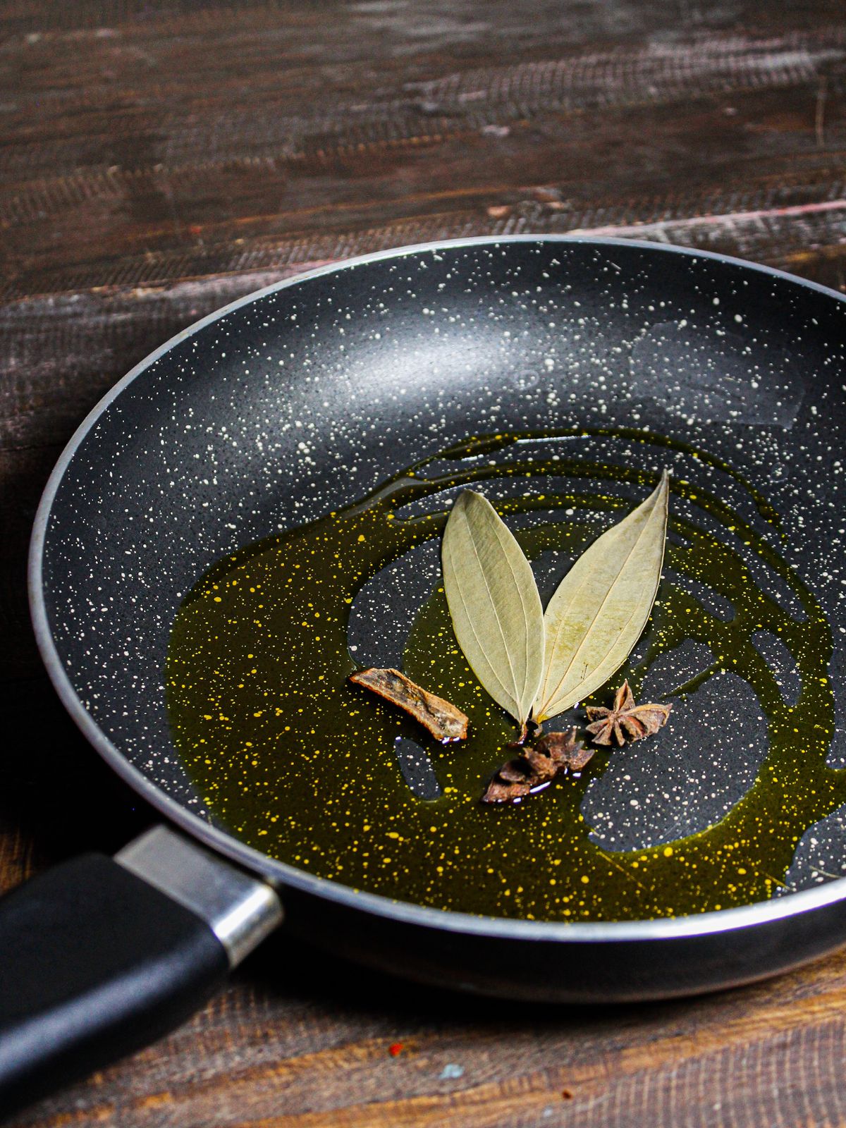 Take Bay leaf, star anise and cinnamon stick in a pan  