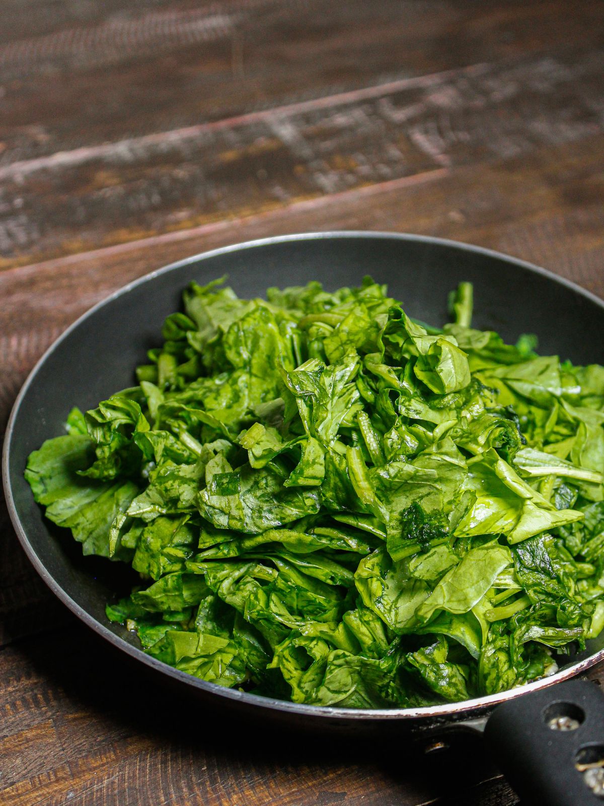 Add chopped spinach to the pan 