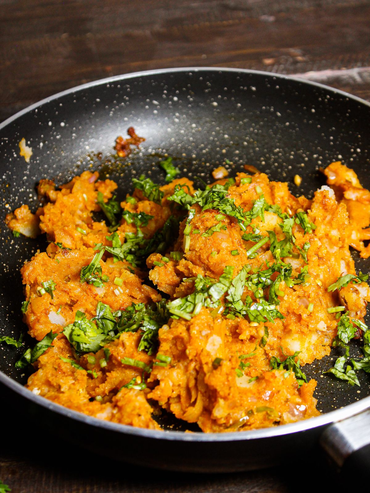 Mix well everything from the pan and garnish with fresh coriander leaves 