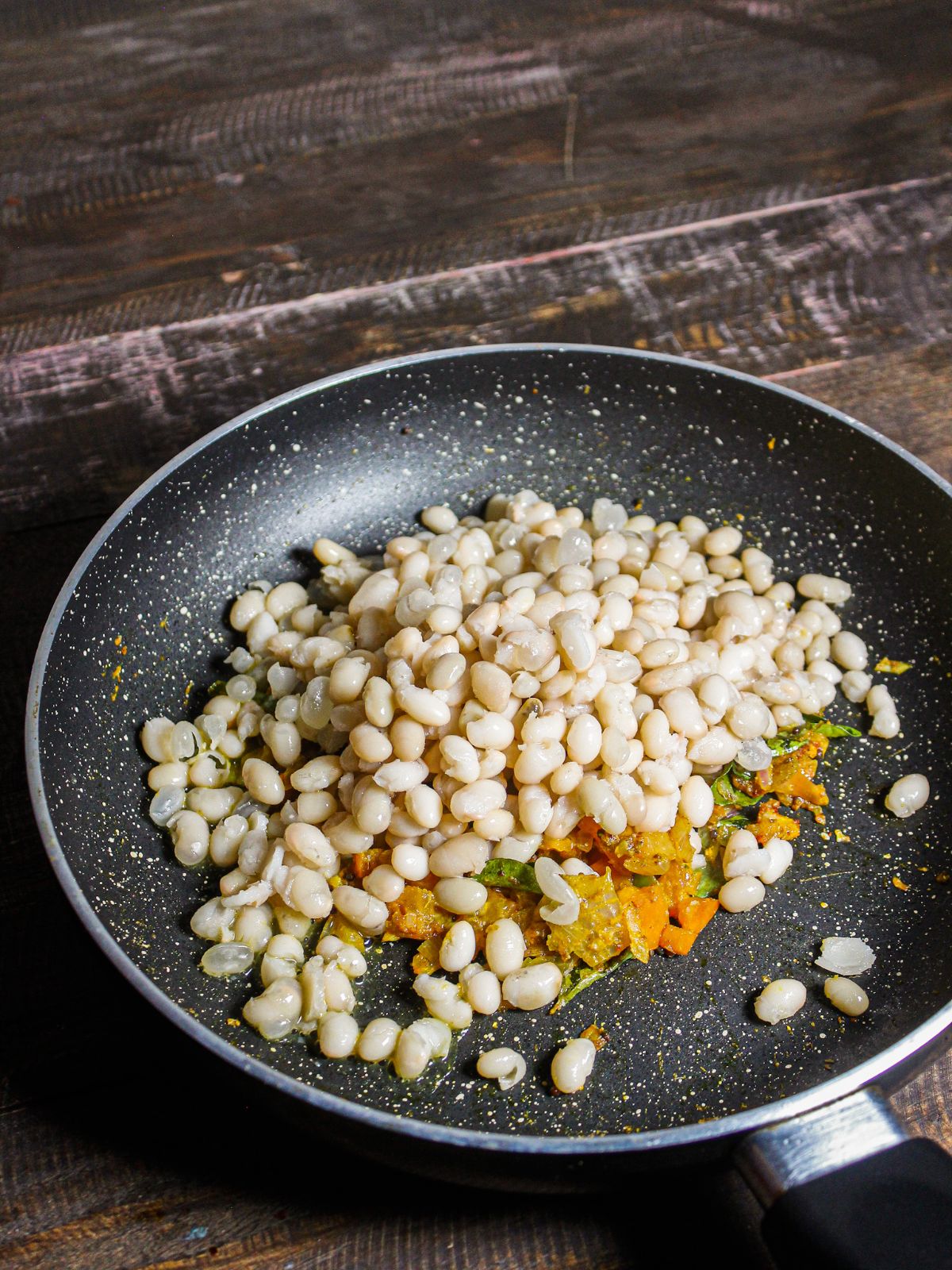 Add soaked soya beans to the pan 