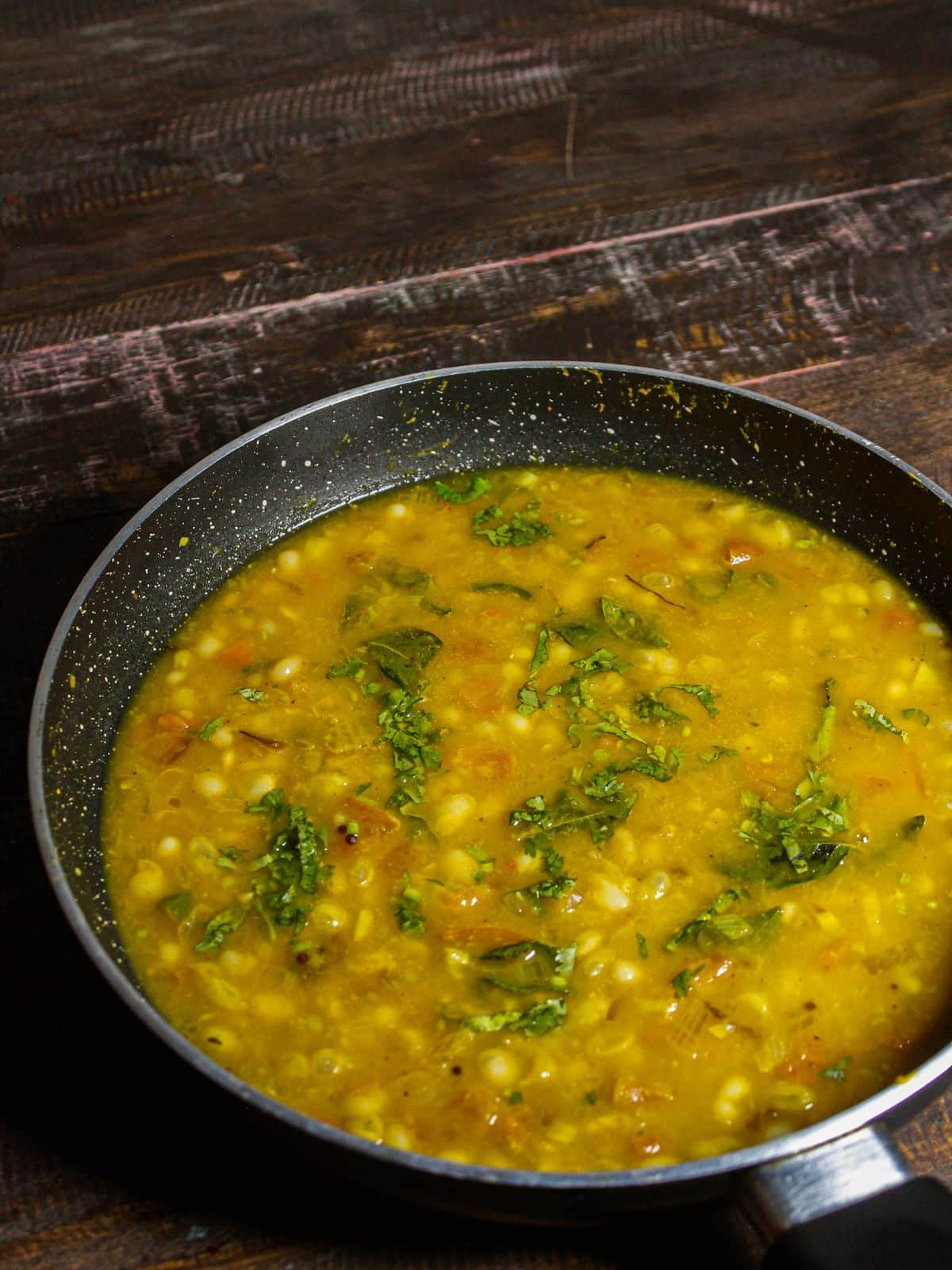 Add chopped coriander leaves to the pan 