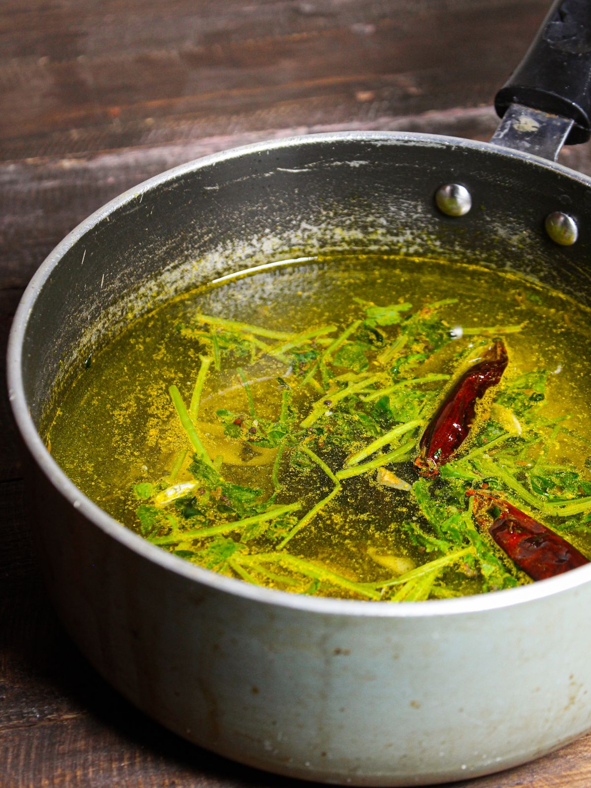 Add tamarind paste to the rasam and let it boil for few mins 